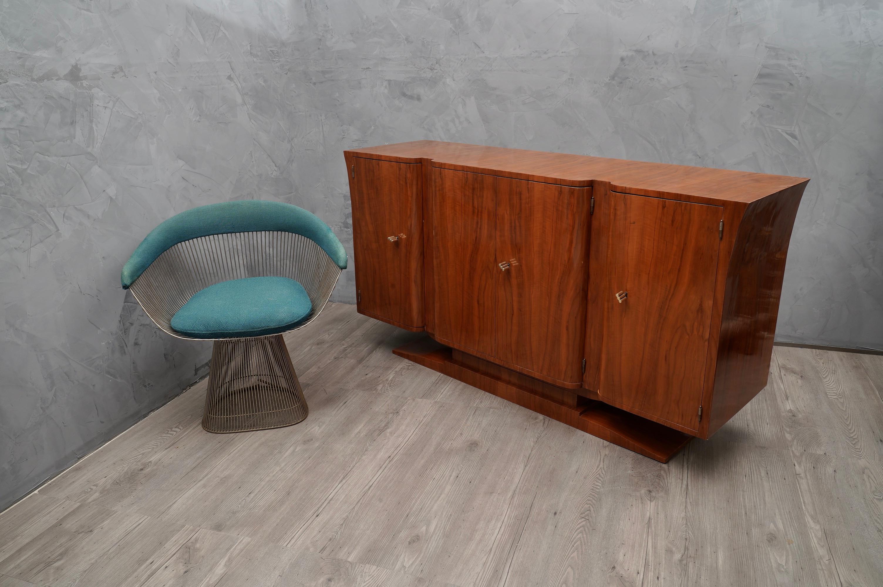Fantastic patina for this cherry wood sideboard, with a very warm color.

All veneer in cherrywood. Composed of four doors, two side singles and two coupled central doors. The doors do not have a sharp edge but rounded edge. The sides of the