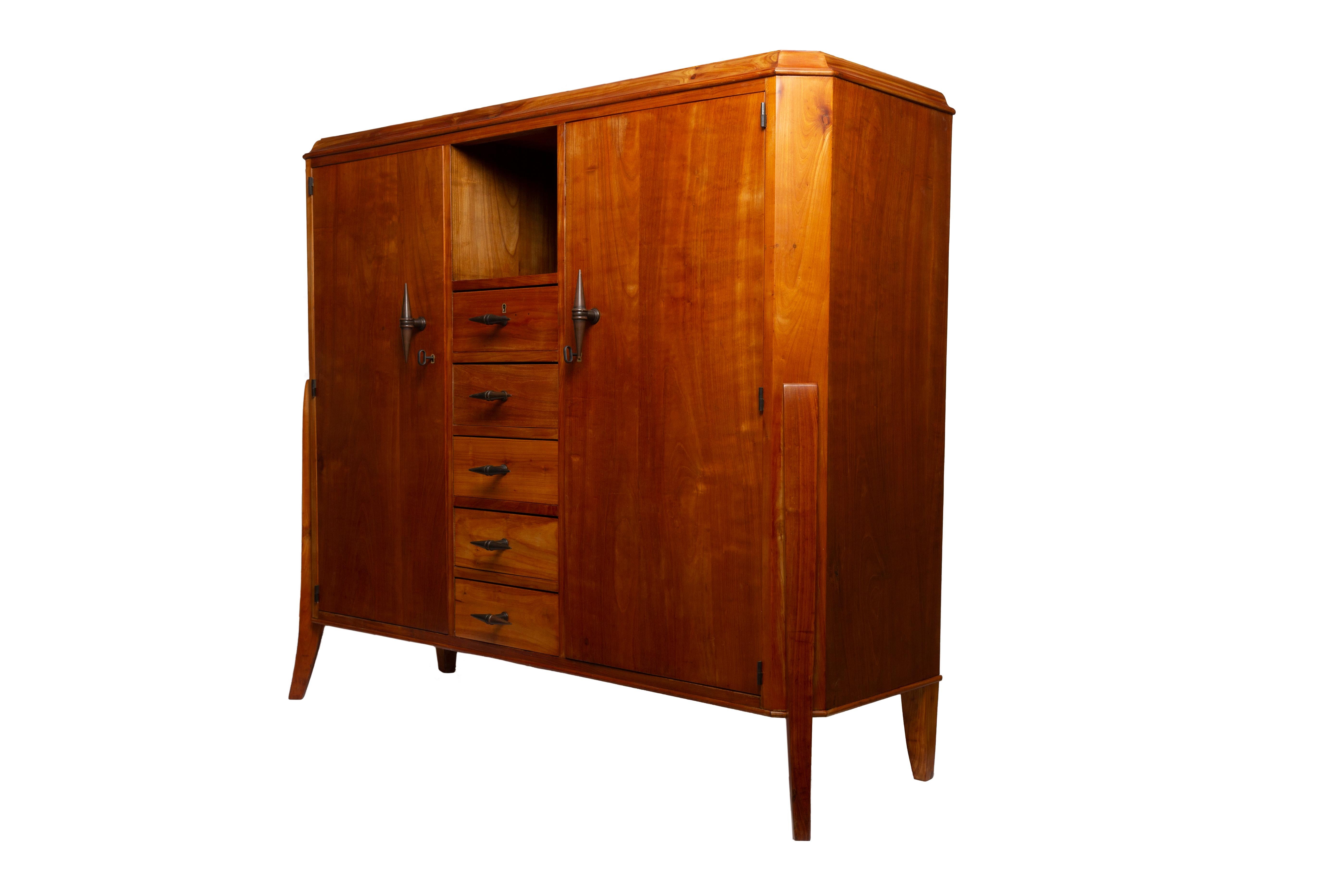 Carefully restored very stylish Art Deco cherrywood veneered sideboard with solid cherrywood details and patinated bronze elements.