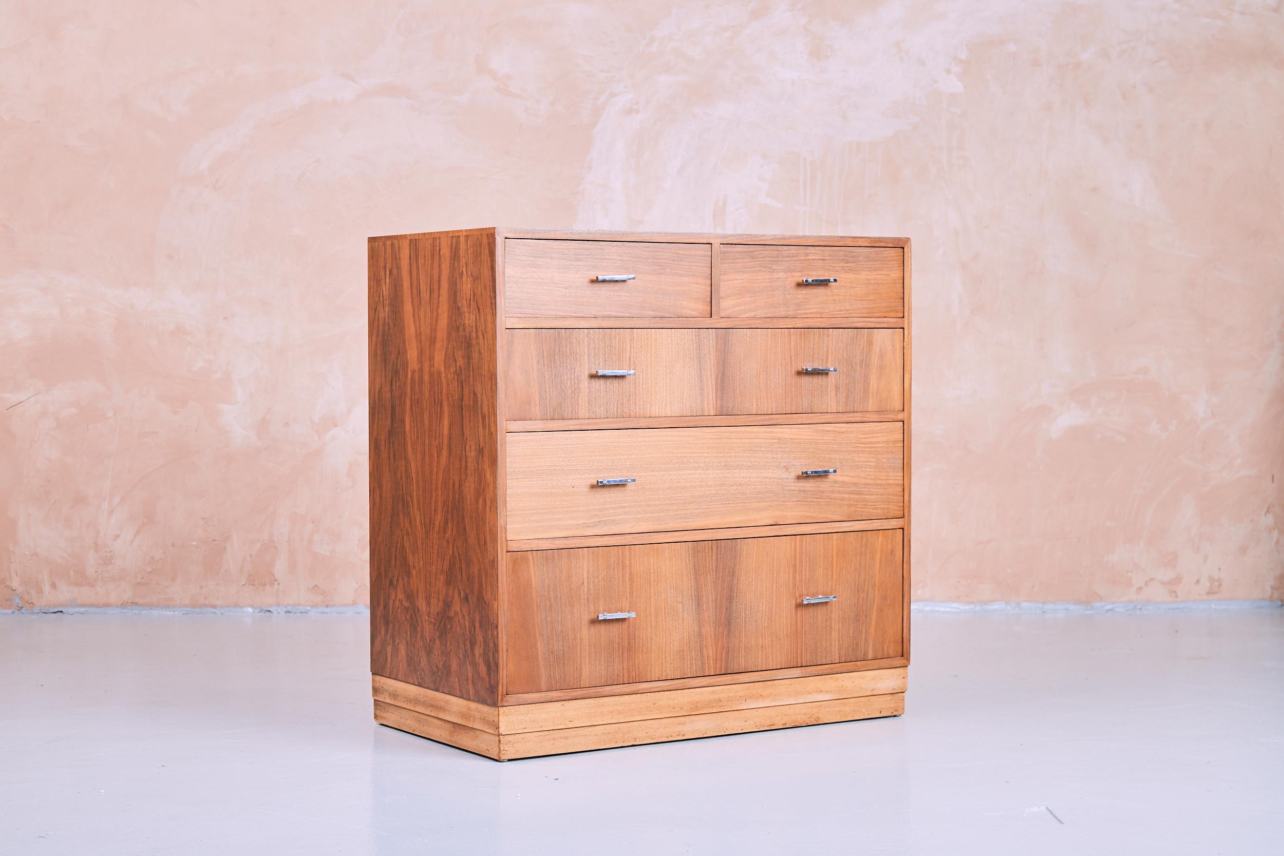 An English four over two walnut chest of drawers, made by the renowned company Hamptons of Pal Mall in London, Hamptons was a fine quality cabinetmaker from this period with good quality dovetail joints good liners all the drawers run smoothly,