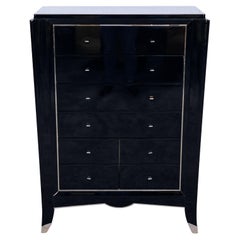 Art Deco Chest of Drawers in Black with Tapered Form and Metal Accents, 1930s