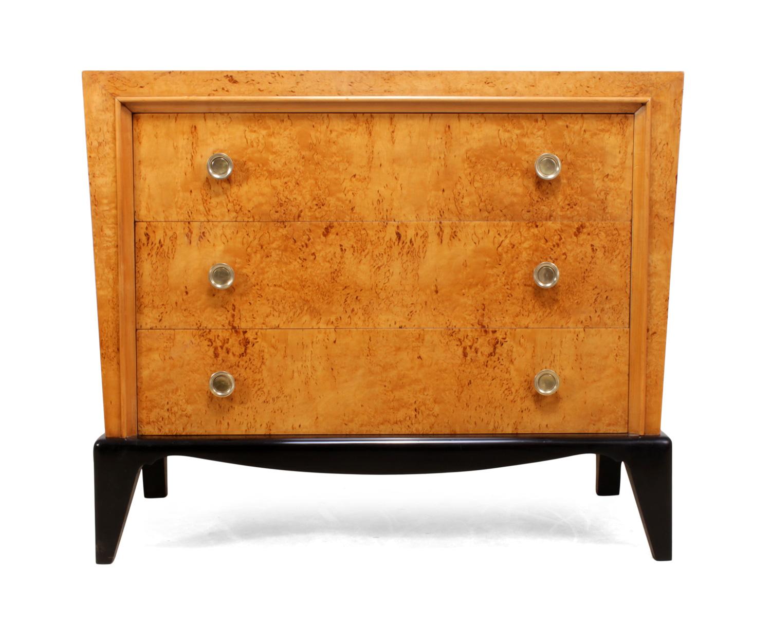 Art Deco chest of drawers in Karelian birch
this French Art Deco chest has three long drawers with brass handles , ebonized base sloping sides and a black glass top

the chest has been fully restored and hand polished

Age: 1920

Style: Art