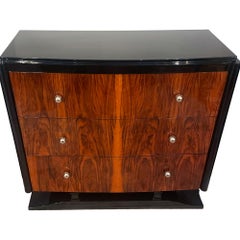 Art Deco chest of drawers in walnut with blackened sides, top, and base