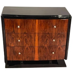 Art Deco chest of drawers in walnut with blackened sides, top, and base