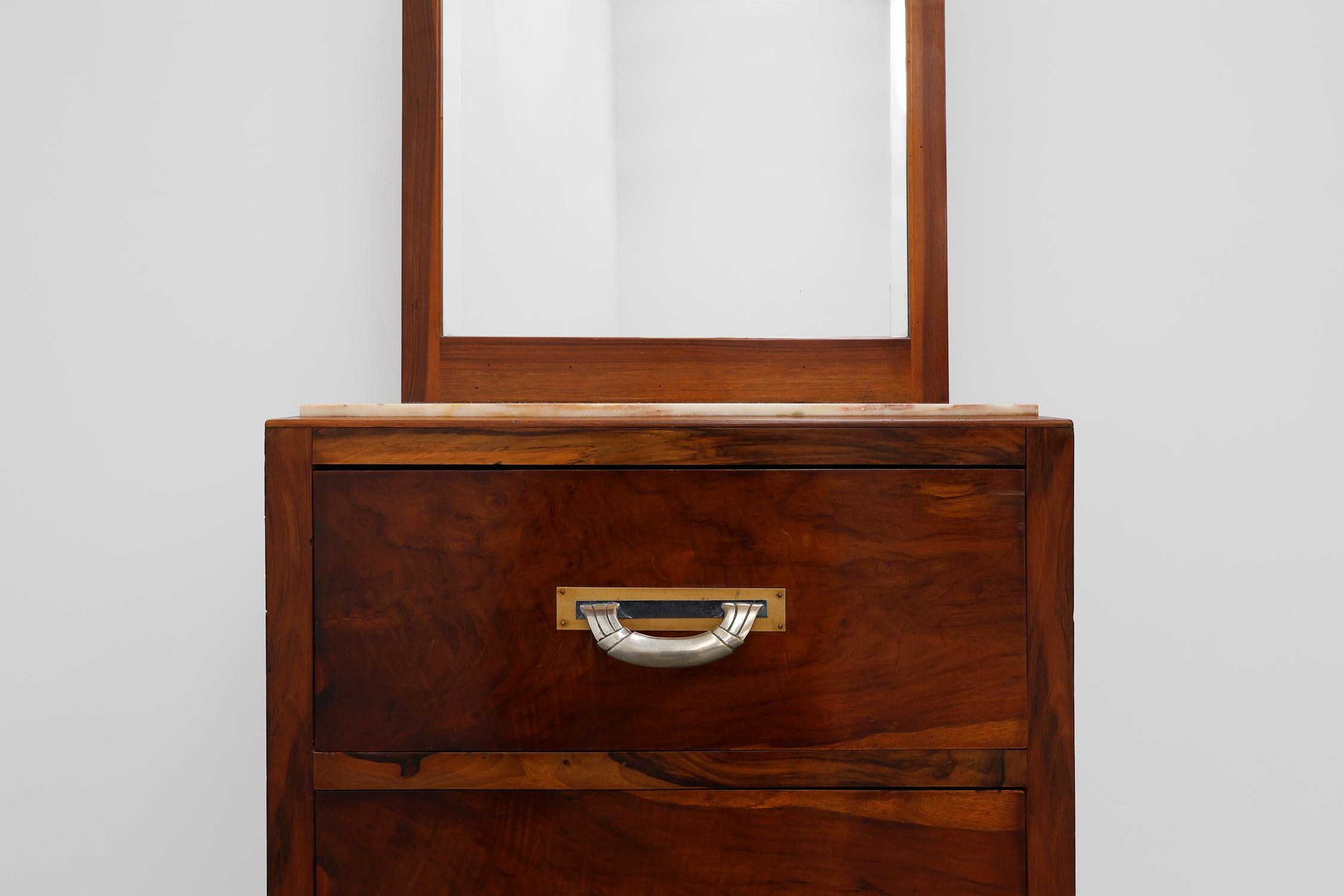 France / 1930 / Cabinet, Dressing Table / wood, metal, marble, mirror / Art Deco

French richly decorated Art Deco dressing table with 3 drawers, a marble top and a large mirror. The 3 drawers have beautiful original and decorative hardware that