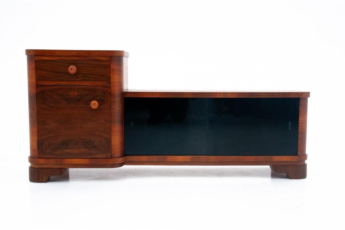 Art Deco style TV chest of drawers from the mid-20th century.

Due to its size, the chest of drawers will work perfectly in the hallway or under the TV. The timeless design will work great in modern interiors.

The furniture is in very good