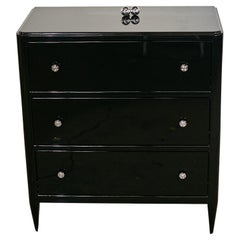 Art Deco chest of drawers with beautiful black piano lacquer and timeless handle