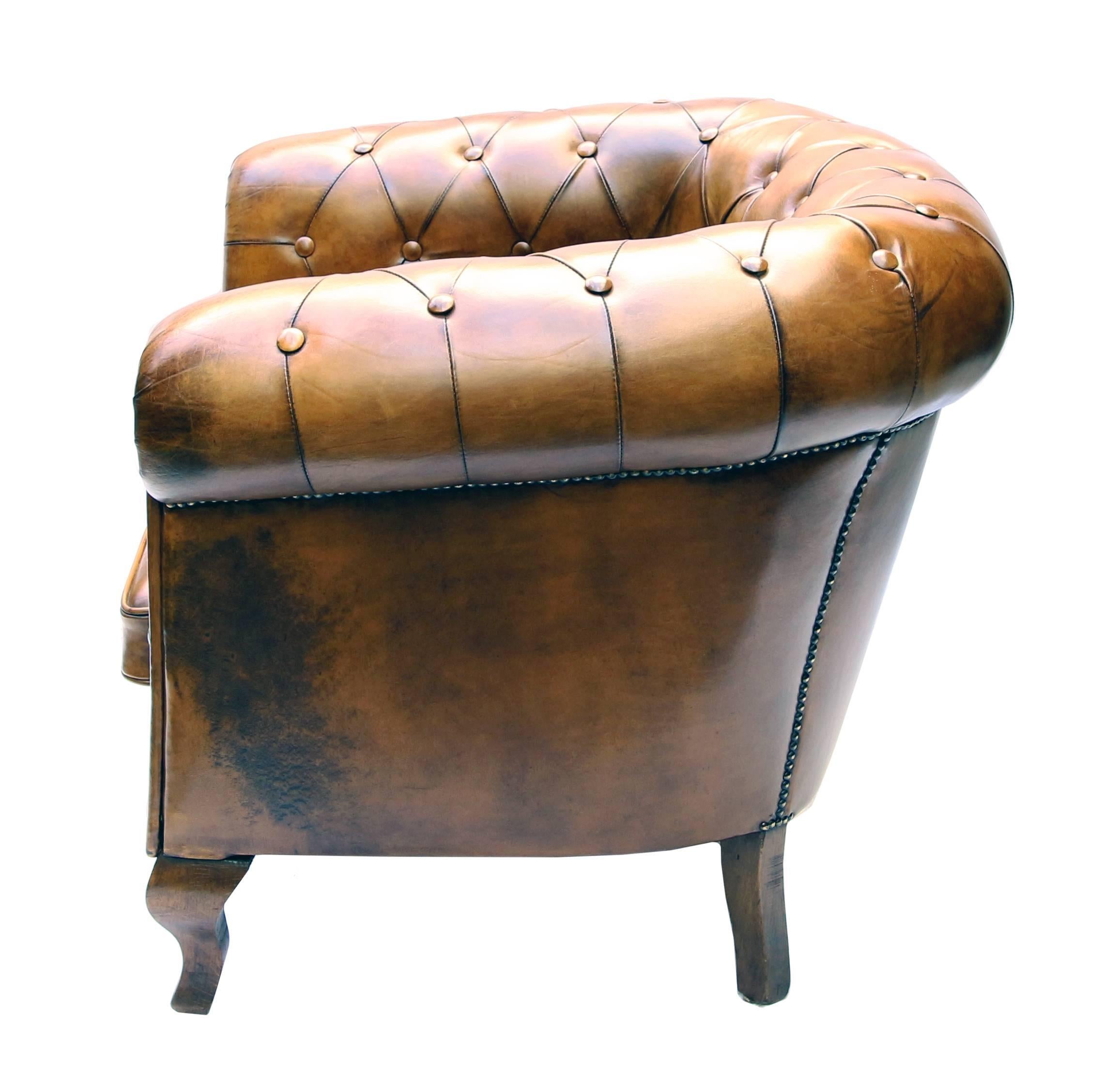 This Art Deco Chesterfield armchair with an original frame of beechwood has been newly upholstered in hand-patinated sheep leather. Very comfortable and extremely robust.
Measures: Seat height 44 cm.