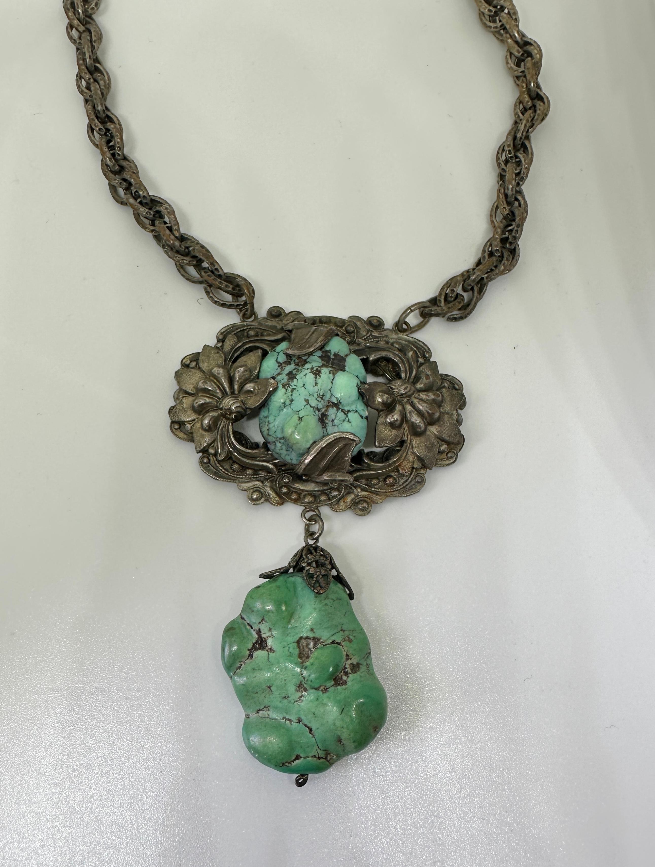 THIS IS AN ANTIQUE ART DECO - VICTORIAN CHINESE EXPORT PENDANT NECKLACE WITH GORGEOUS NATURAL UNTREATED SPIDER WEB TURQUOISE IN A DRAMATIC AND WONDERFUL CHRYSANTHEMUM FLOWER DESIGN IN SILVER.  A VERY RARE AND WONDERFUL JEWEL!
The stunning effect of