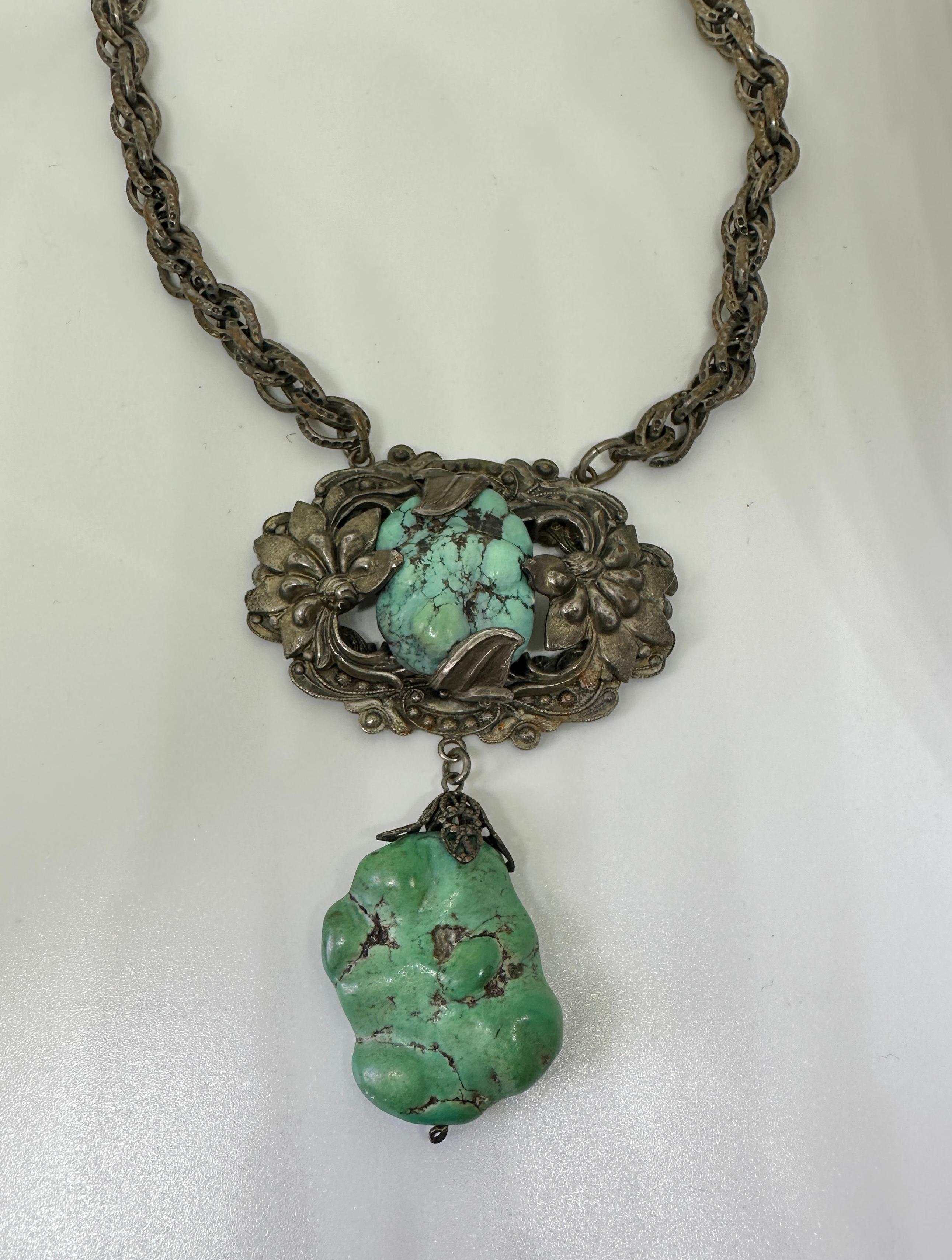 THIS IS AN ANTIQUE ART DECO - VICTORIAN CHINESE EXPORT PENDANT NECKLACE WITH GORGEOUS NATURAL UNTREATED SPIDER WEB TURQUOISE IN A DRAMATIC AND WONDERFUL CHRYSANTHEMUM FLOWER DESIGN IN SILVER.  A VERY RARE AND WONDERFUL JEWEL!
The stunning effect of