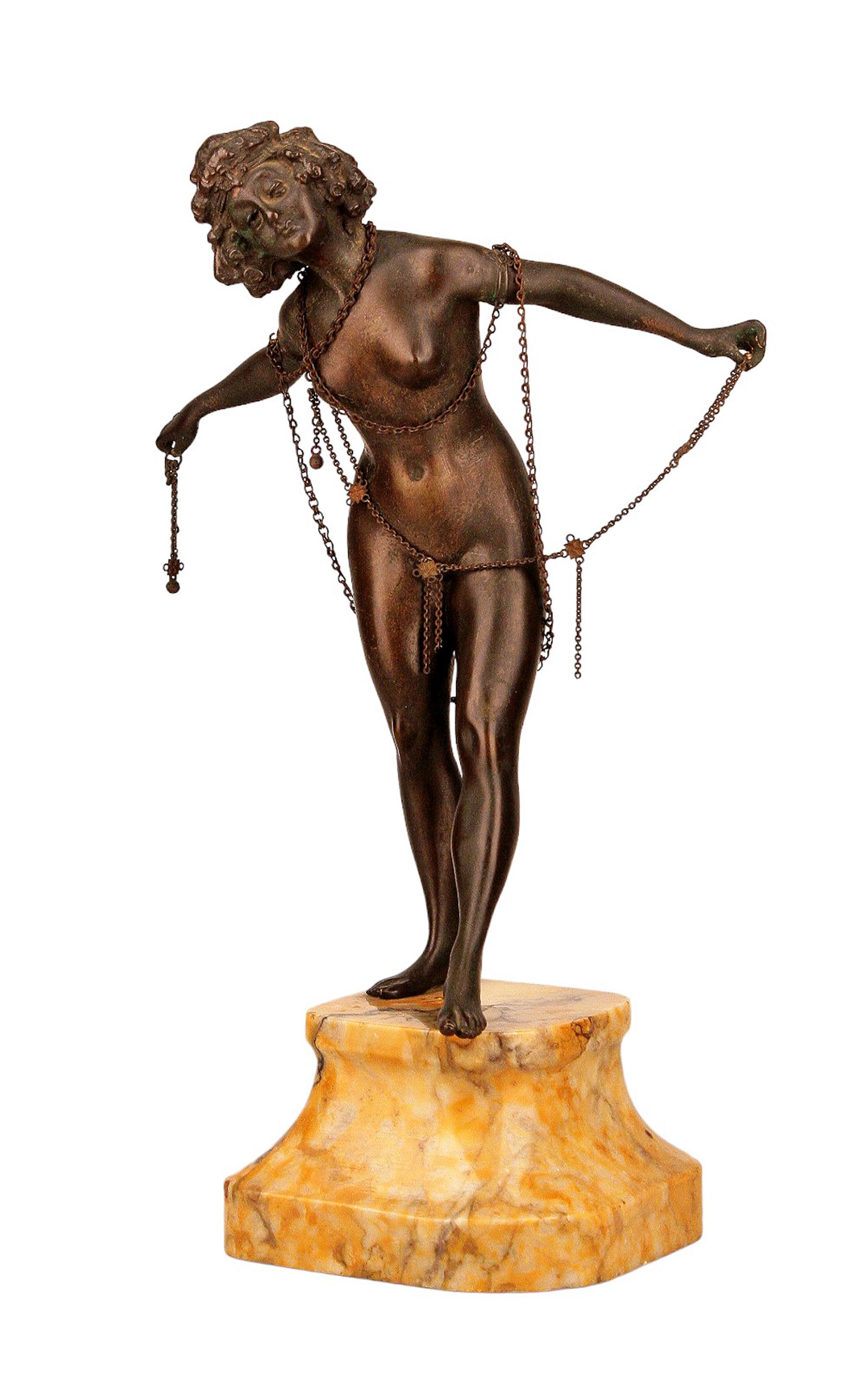 Art Déco french nude lady in chains bronze sculpture with stone base in the style of Demetre Chiparus

By: Demetre Chiparus (in the style of)
Material: bronze, copper, metal, stone
Technique: cast, molded, polished, metalwork, patinated
Dimensions: