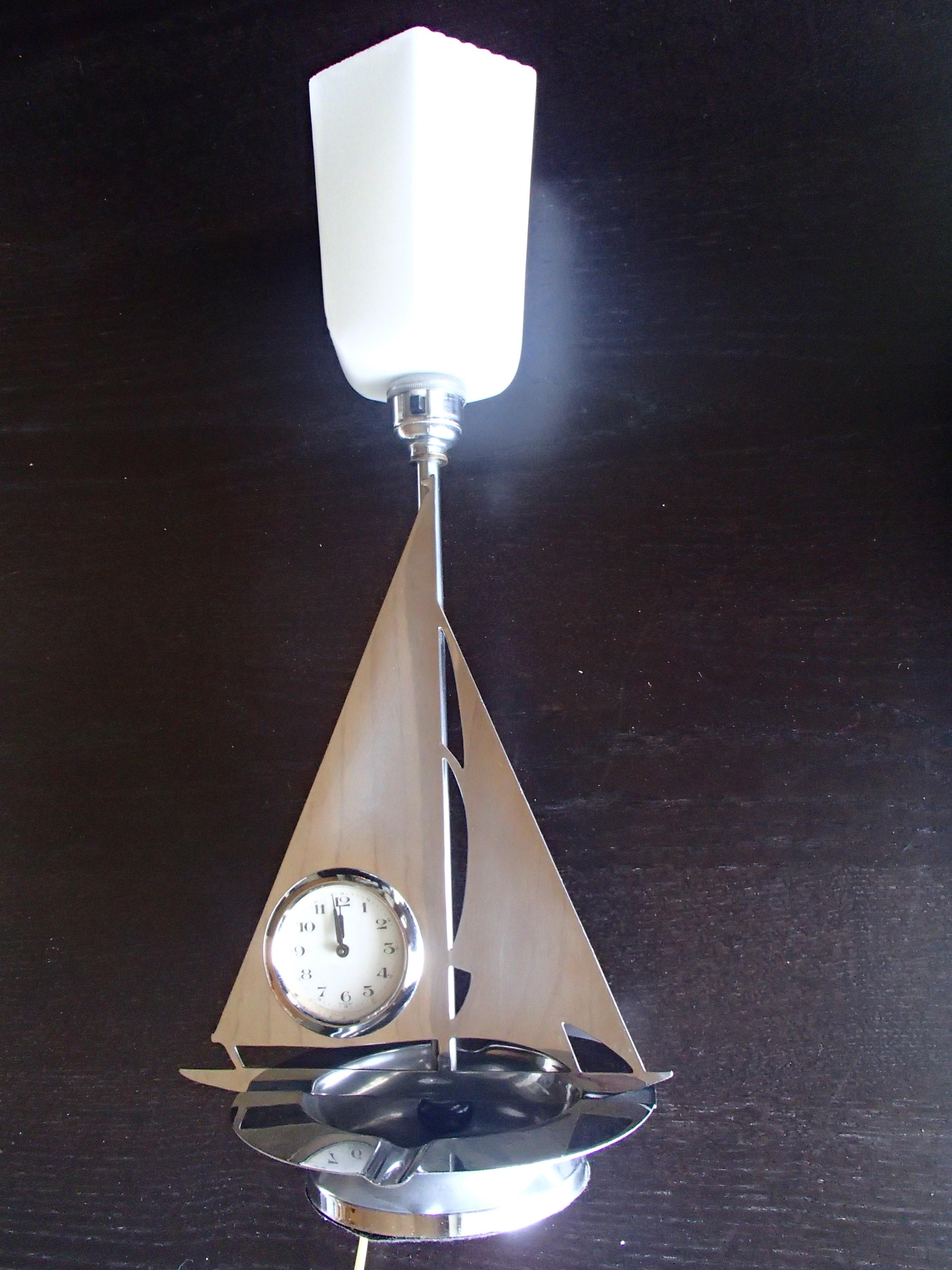 Art Deco chrom sailing boat table lamp with clock and ashtree.