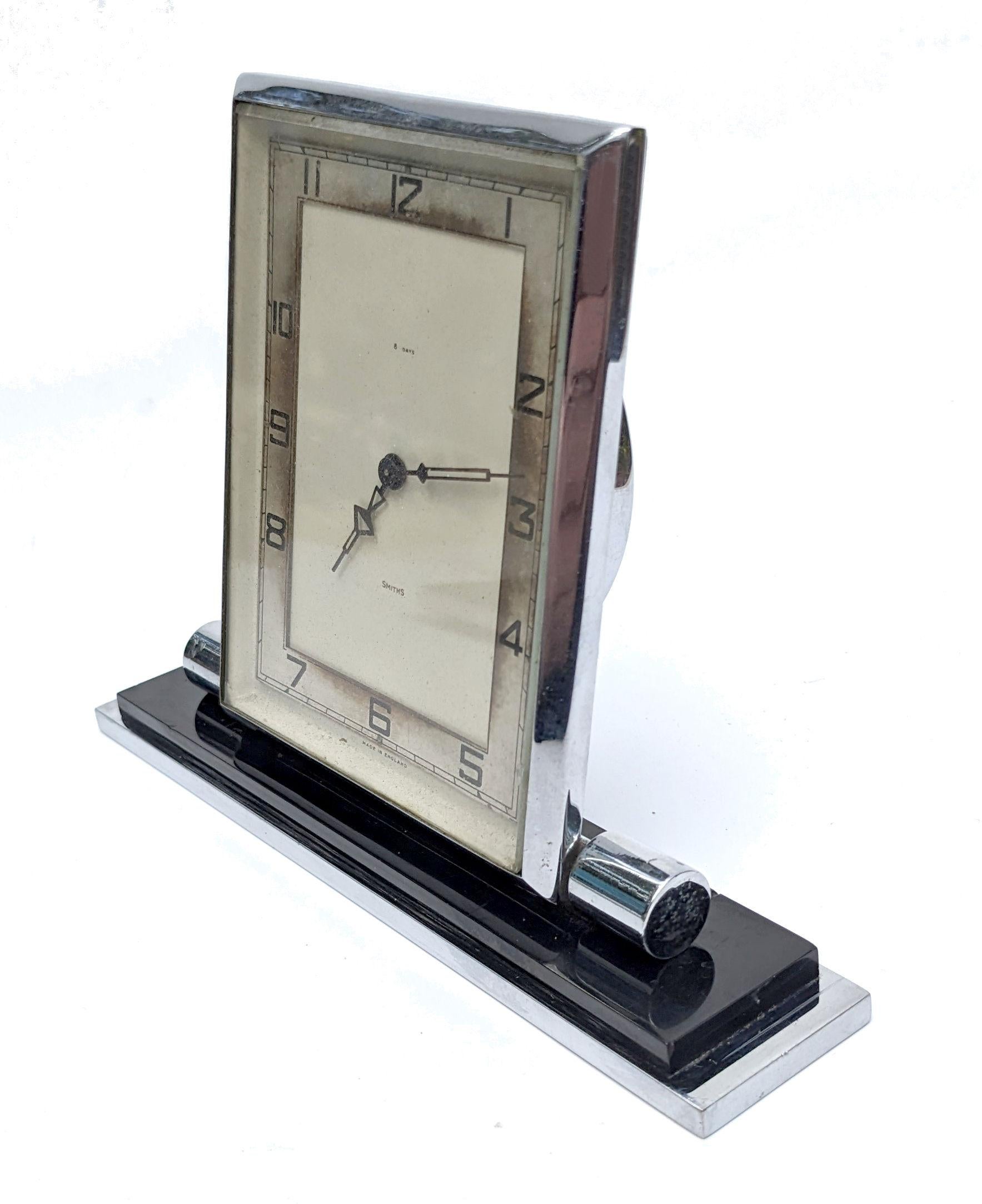 Is this very iconic shaped Art Deco chrome & bakelite table clock made by the English Clockmakers 'Smiths' dating to 1930 the Art Deco period. Fully working and serviced by a qualified horologist. A superb Interiors piece perfect for a bedroom or