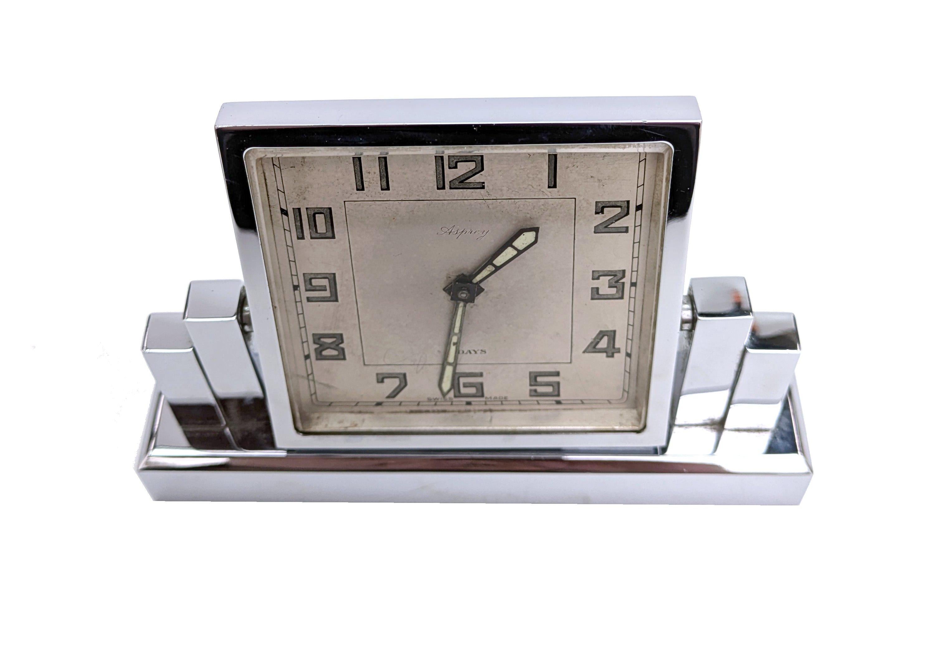 Made by the iconic British Luxury Brand, Asprey. This is a genuine Art Deco period desk clock. Comes in a highly polished chrome finish. It has a Swiss 8 day movement and is in working order. Wonderful skyscraper casing. The body of the clock can be