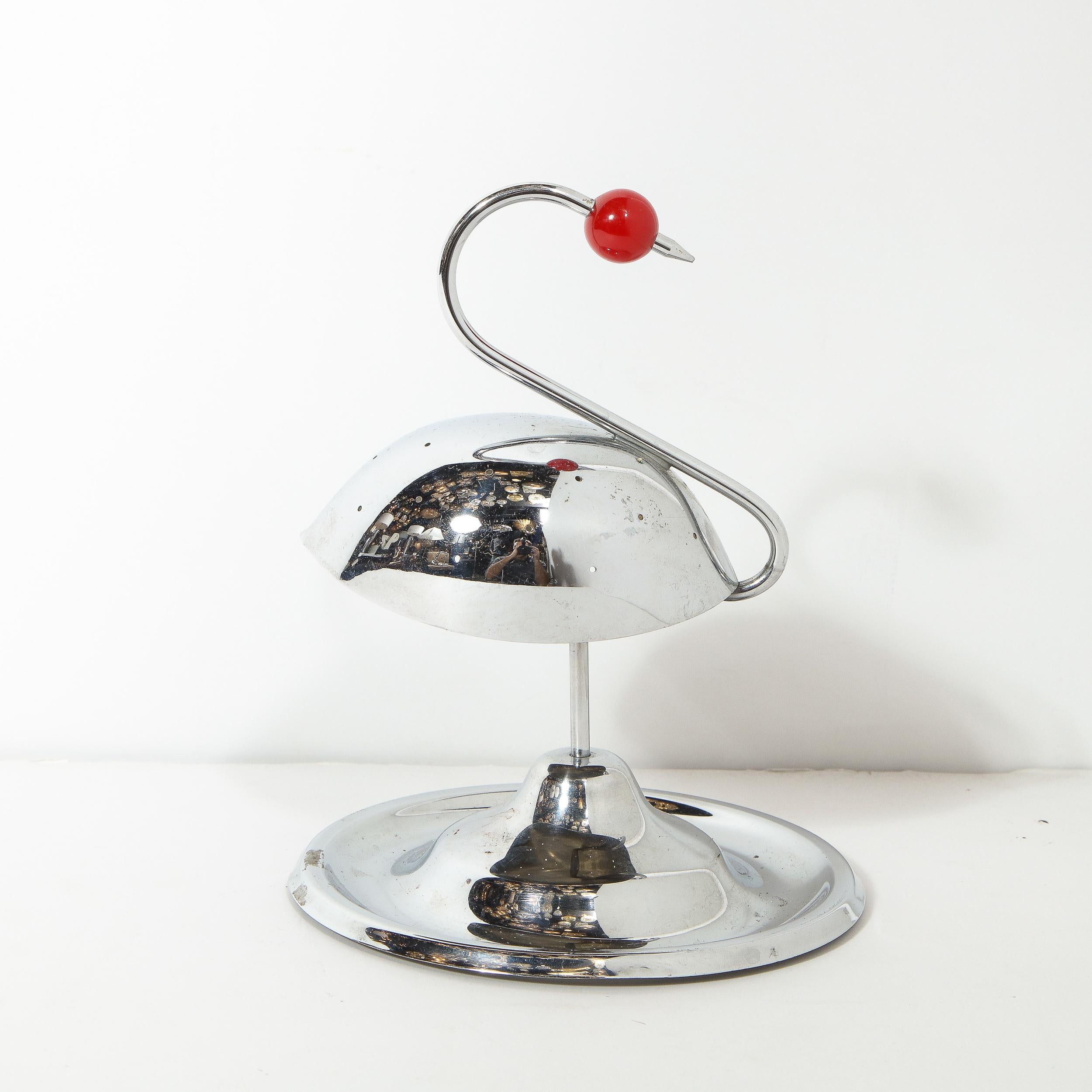 This whimsical and refined Art Deco cocktail holder was realized by the esteemed maker Napier Co. in the United States, circa 1935. It offers the stylized silhouette of a swan featuring a convex undulating base; a cylindrical stem; a domed and