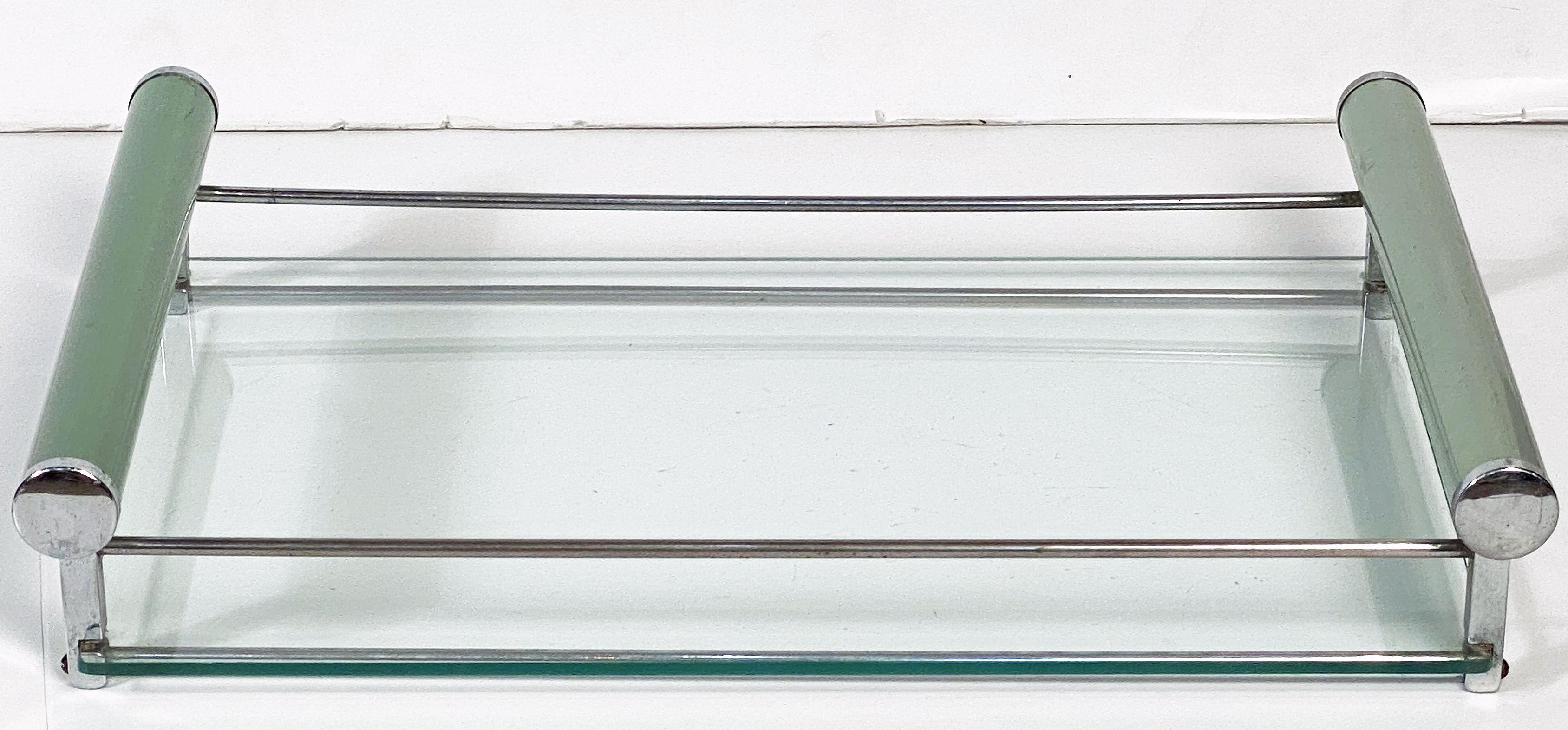 A fine period English serving tray for drinks and cocktails from the Art Deco era featuring a a chrome metal frame with an inset rectangular glass and opposing brushed green tubular metal handles.