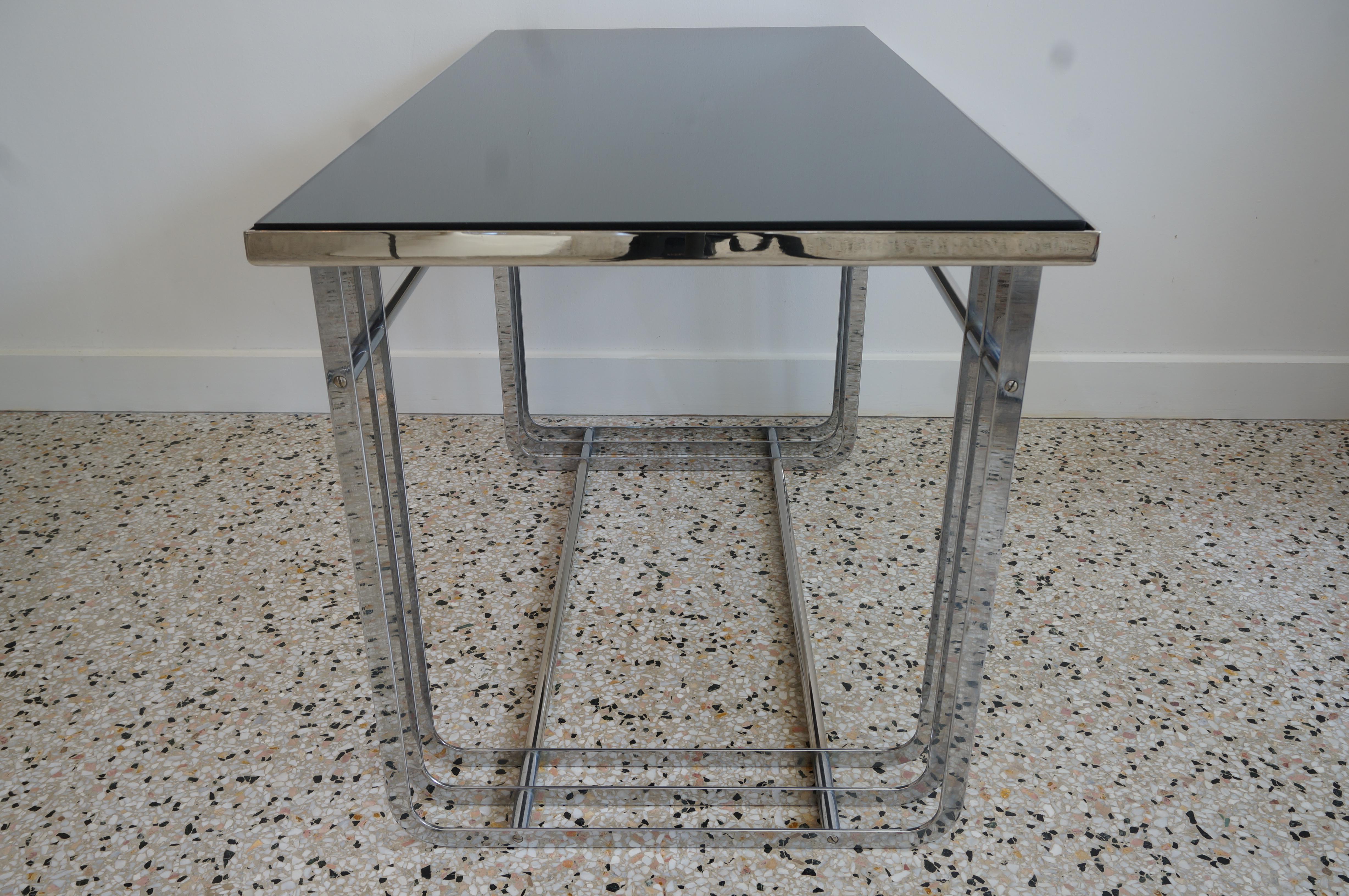 This stylish Art Deco cocktail table is by Donald Deskey and date to the 1920s-1930s with its stream-lined machine-age look in polished chrome and black glass.

FYI:-
Deskey. Donald Deskey (November 23, 1894–April 29, 1989) was a native of Blue