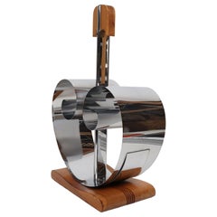 Revistero extensible de estilo Art Déco en cromo y nogal, diseñado por Fred D. Farr para Revere