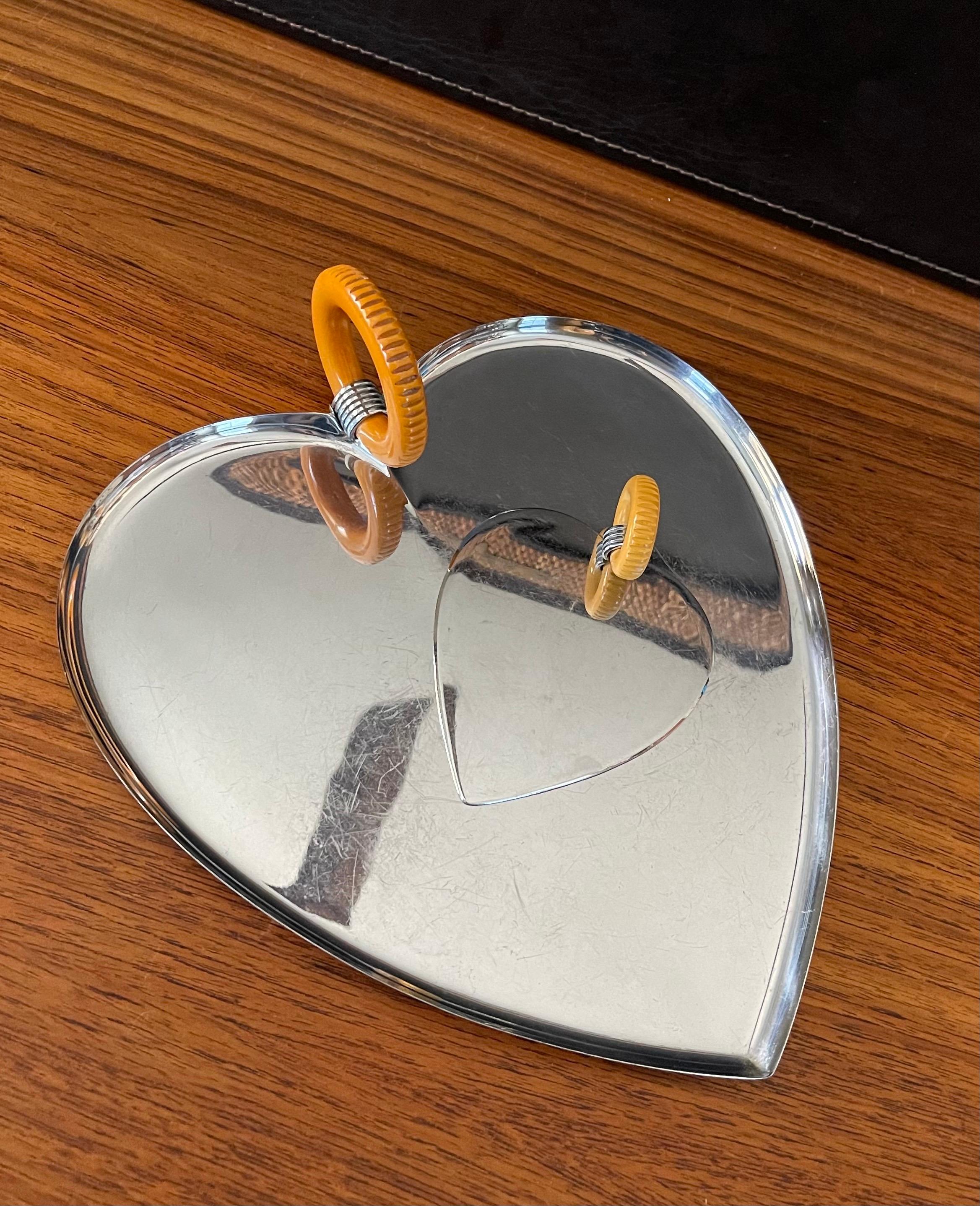 Art Deco chrome & bakelite heart tray and spatula by Chase Co., circa 1930s. The large tray (10.75