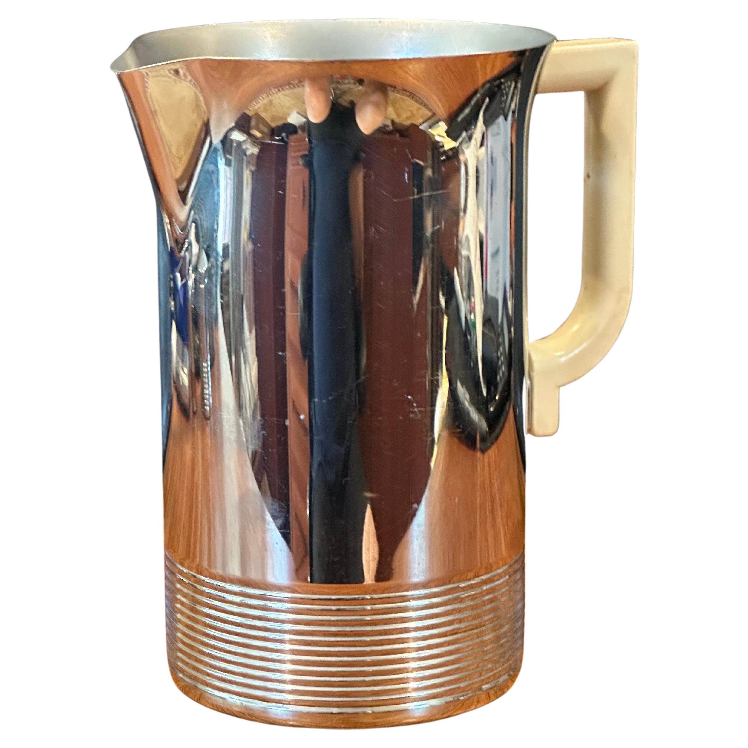 Art Deco chrome and bakelite water pitcher by Chase Co., circa 1930s.  The pitcher is in good vintage condition, measures 5W