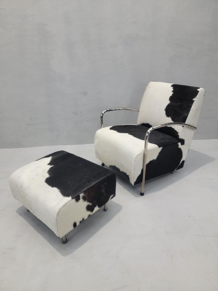 1950s German Art Deco Chrome Bar Lounge & Ottoman Set Newly Upholstered in BrazilIan Black & White Hair-on Cowhide - Set of 2

Introducing the 1950s German Art Deco Chrome Bar Lounge & Ottoman Set, a stunning addition to any modern interior. This