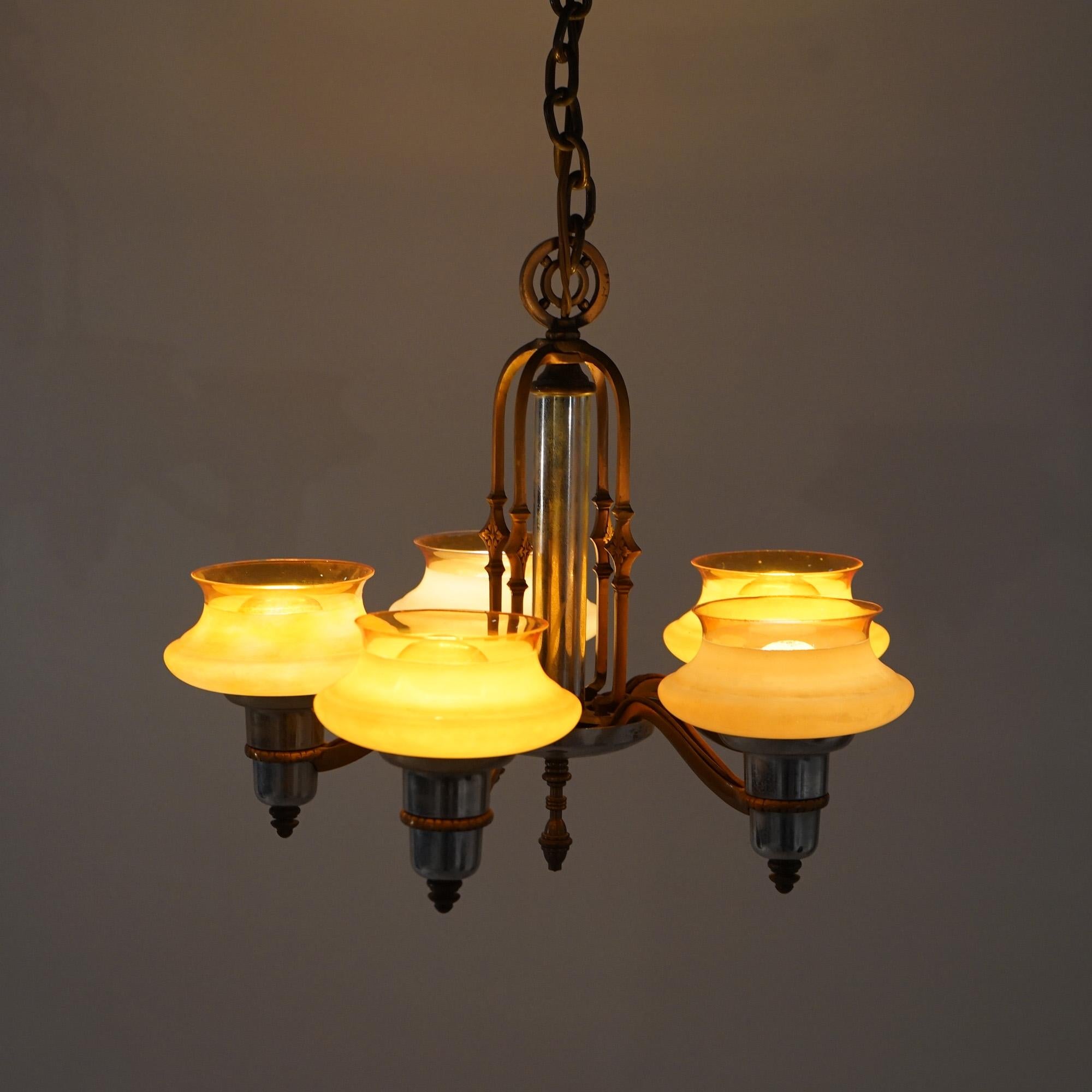 Art Deco Chrome & Bronzed Metal Chandelier with Amber Glass Shades C1920

Measures- 29''H x 16.5''W x 16.5''D; 14'' drop