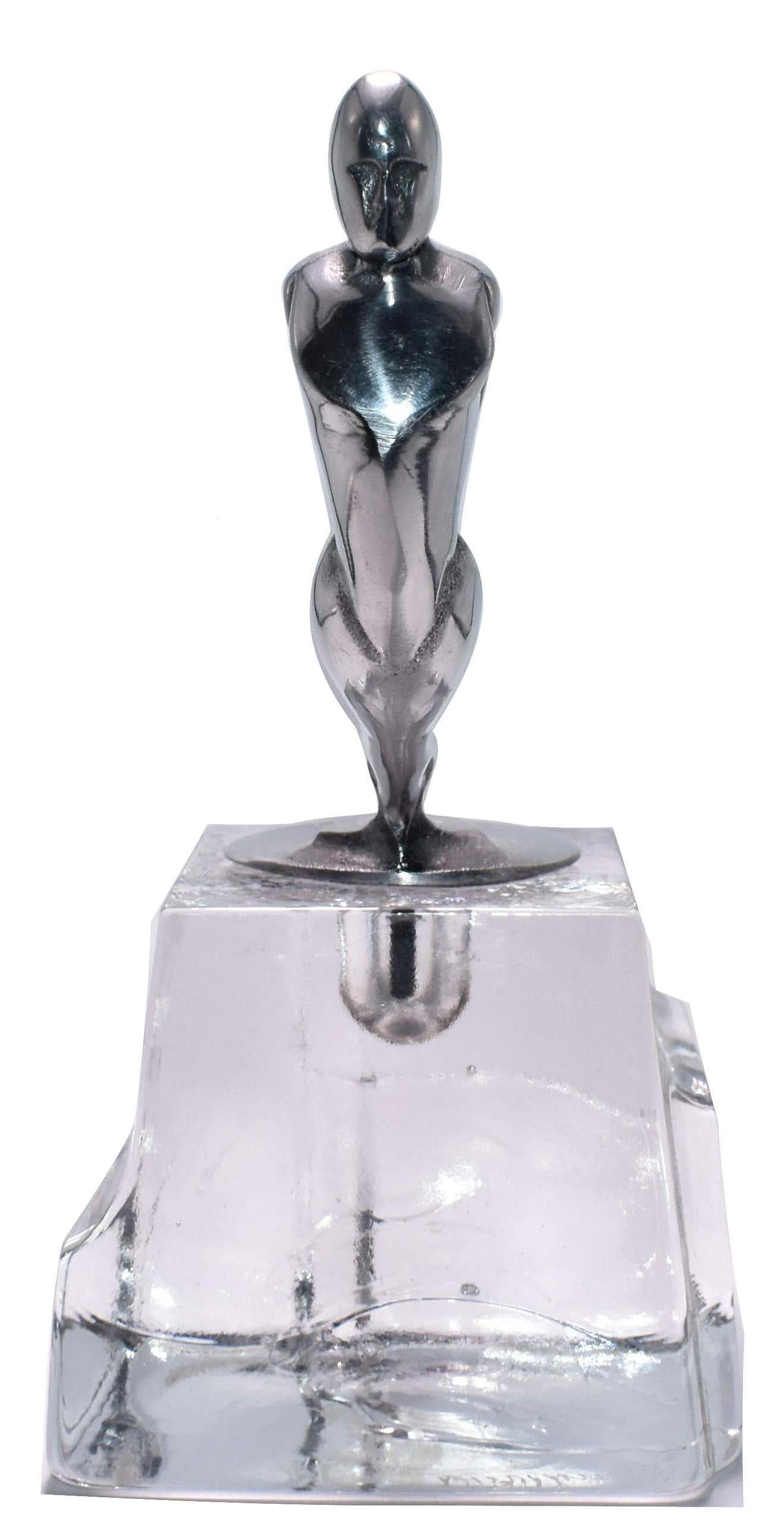 Stunning Art Deco chrome car mascot mounted on a solid block of Swedish art glass. The mascot is original to the 1930's, the base of course is a later addition and makes for a perfect paper weight or just an ornament to appreciate. This is a very
