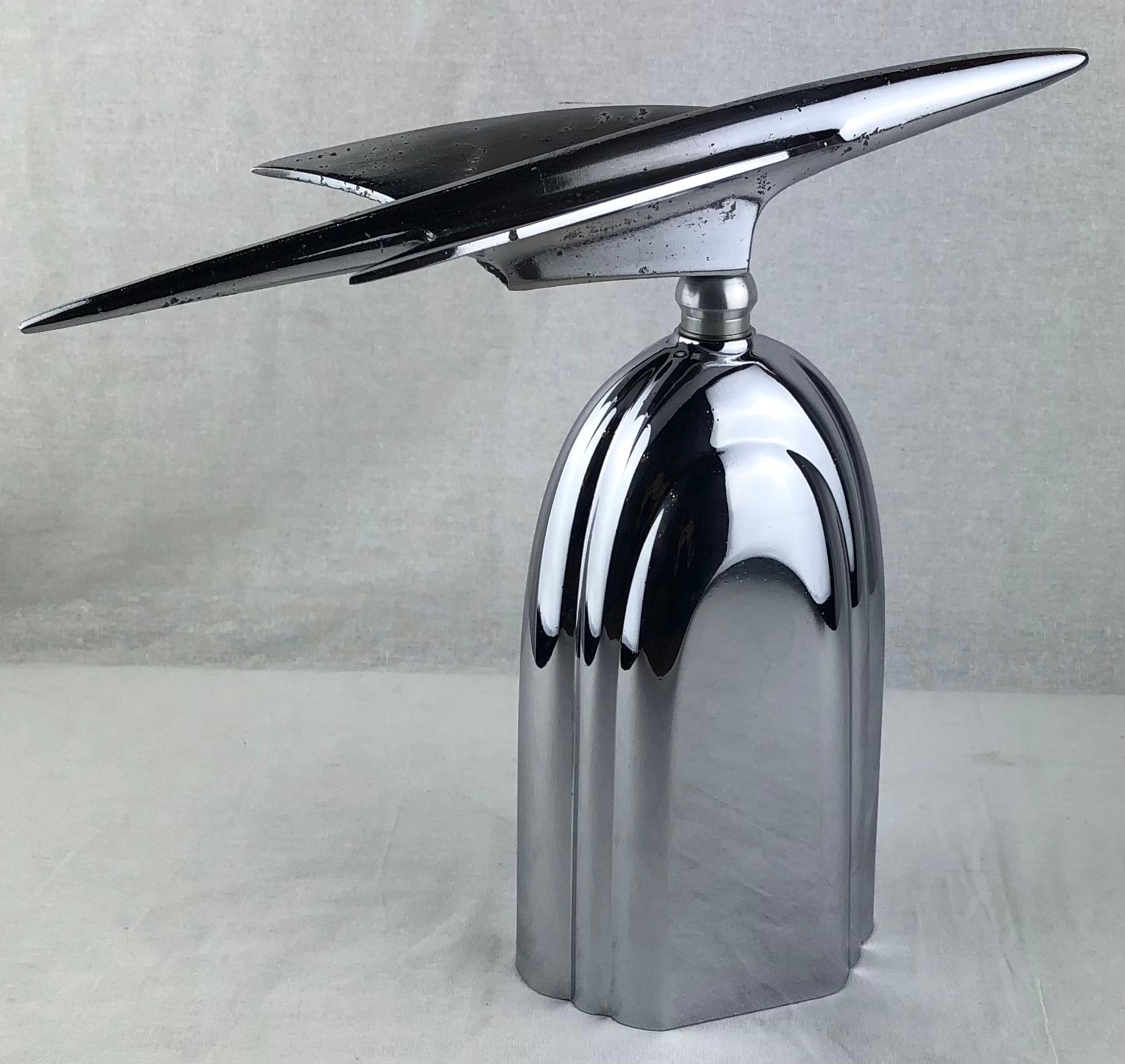 Stunning Art Deco chrome car mascot mounted on a solid chrome base that depicts the Chrysler Building in New York. The base is pure Art Deco style, circa 1930's. 

This makes for a very nice sculpture to display on a shelf, console or desk.
