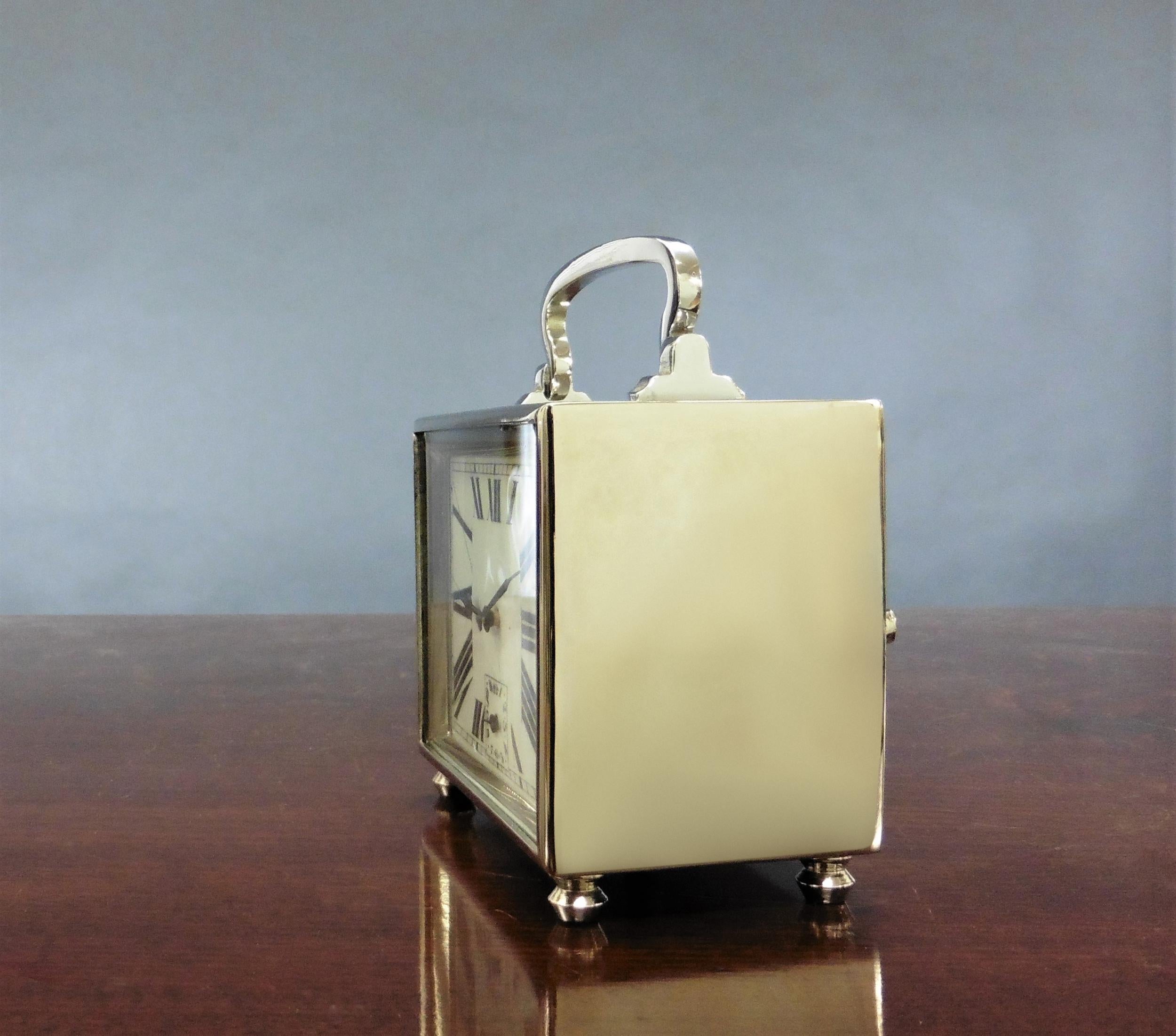 Art Deco carriage alarm clock


Art Deco chrome plated rectangular carriage clock standing on four bun feet surmounted by a decorative carrying handle.

Enamel dial with Art Deco style Roman numerals and subsidiary dial for the alarm at six