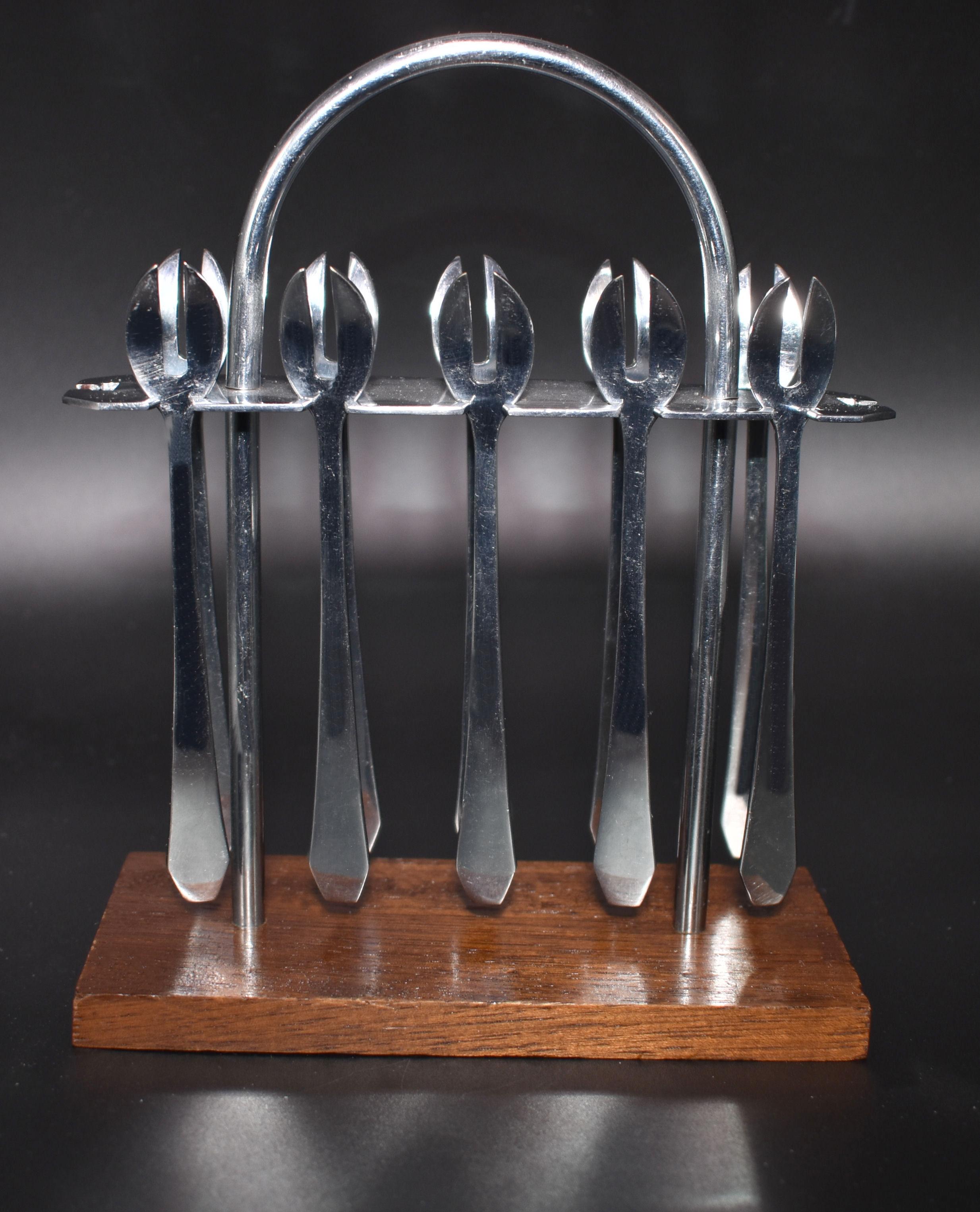 Art Deco chrome cocktail fork set originating from France. Features a rack of small cocktail chrome forks, resting on a walnut base. Lovely set in very great condition, minimal signs of age.