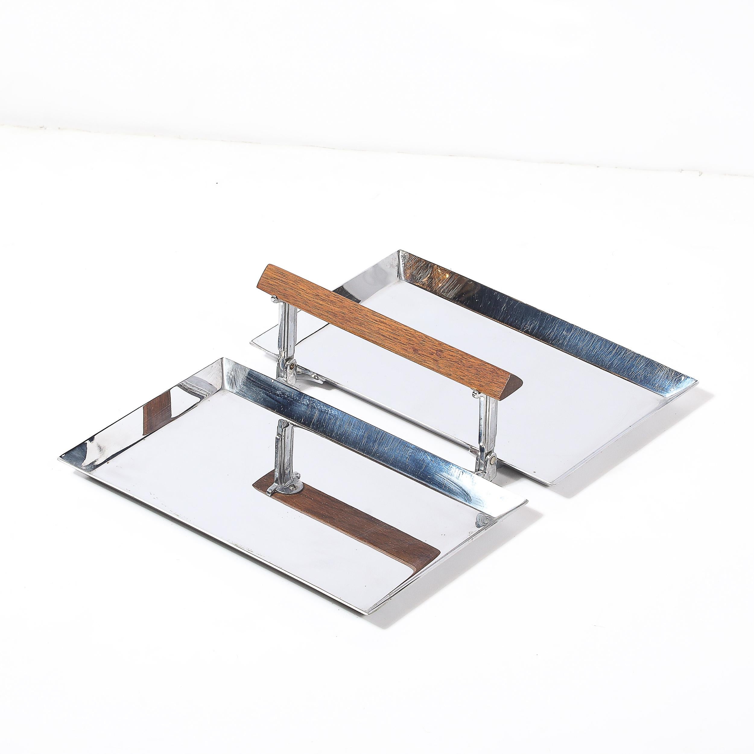 Exuding modernist charm and functional ingenuity, this Art Deco folding tray is a stylish example of streamlined industrial design crafted in America circa 1935. Featuring a polished chrome surface paired with a striking triangular walnut handle,