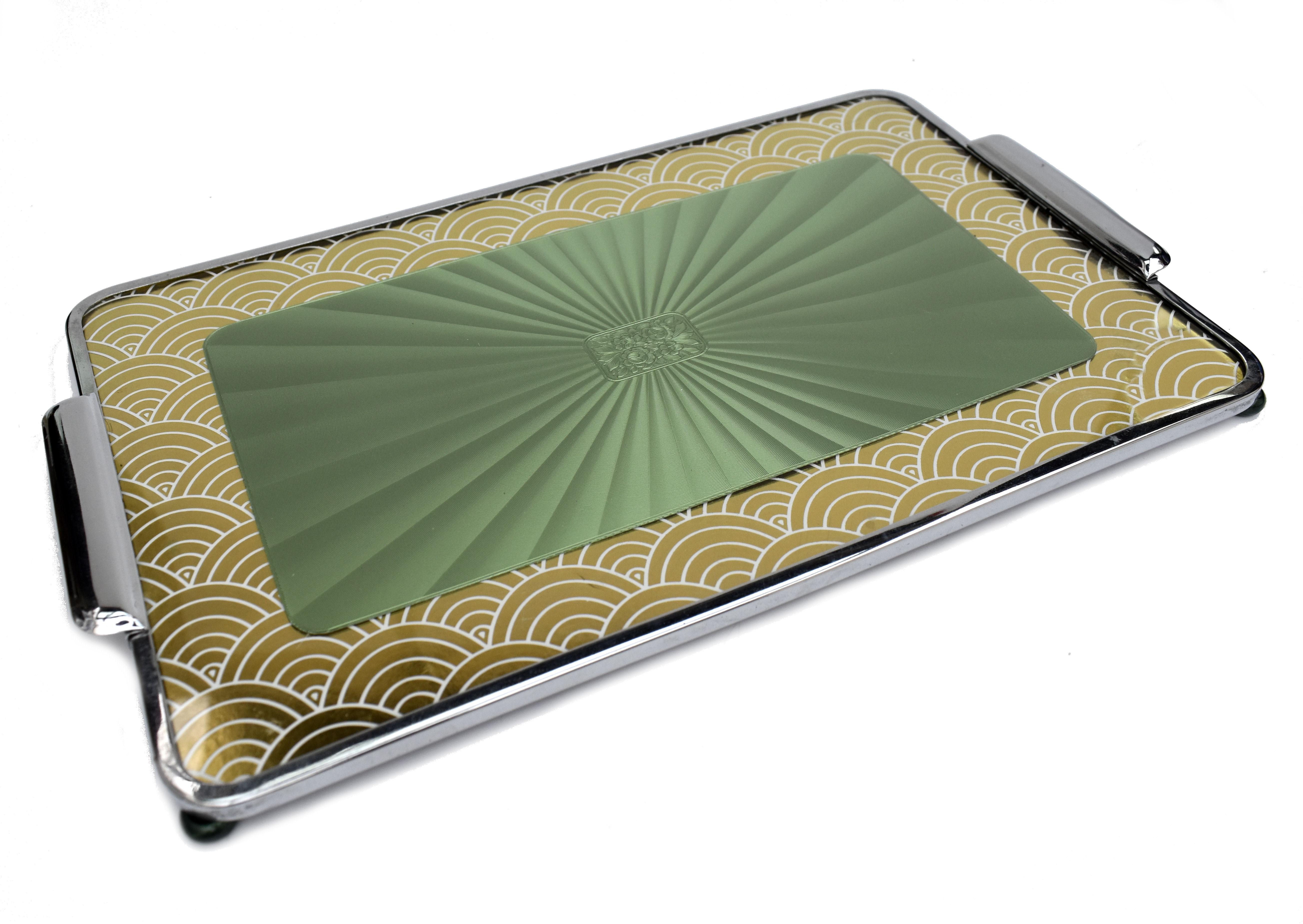 A cute size and original 1930's English Art Deco tray featuring a wonderful cloud border in gold and white with a radial green central pattern behind glass. Condition is very good, no damage, very minor signs of age. Very distinctive Deco motif with