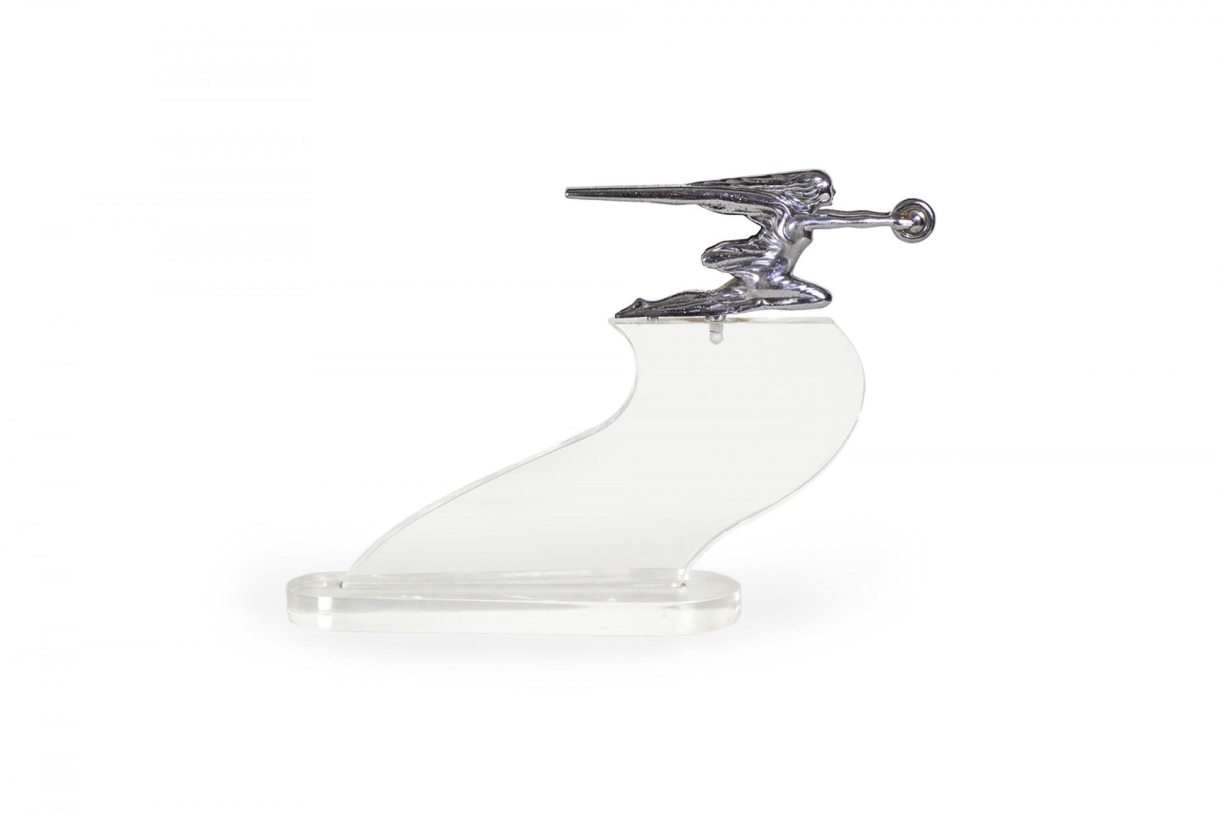 American Art Deco chrome hood ornament/figure of woman with wheel on Lucite base (Goddess of Speed, 1939 - 1942 Parkard, designed by JOHN D. WILSON).