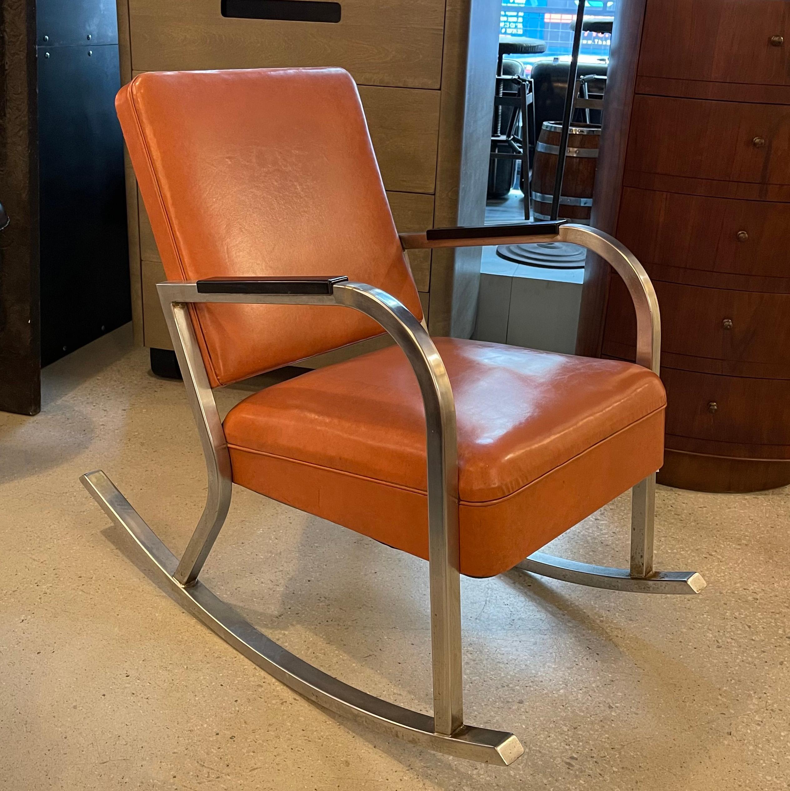 Art Deco, rocking chair by Gilbert Rohde features a chrome frame with Bakelite armrests with lether upholstered seat and back. Solid, stylish and comfortable.