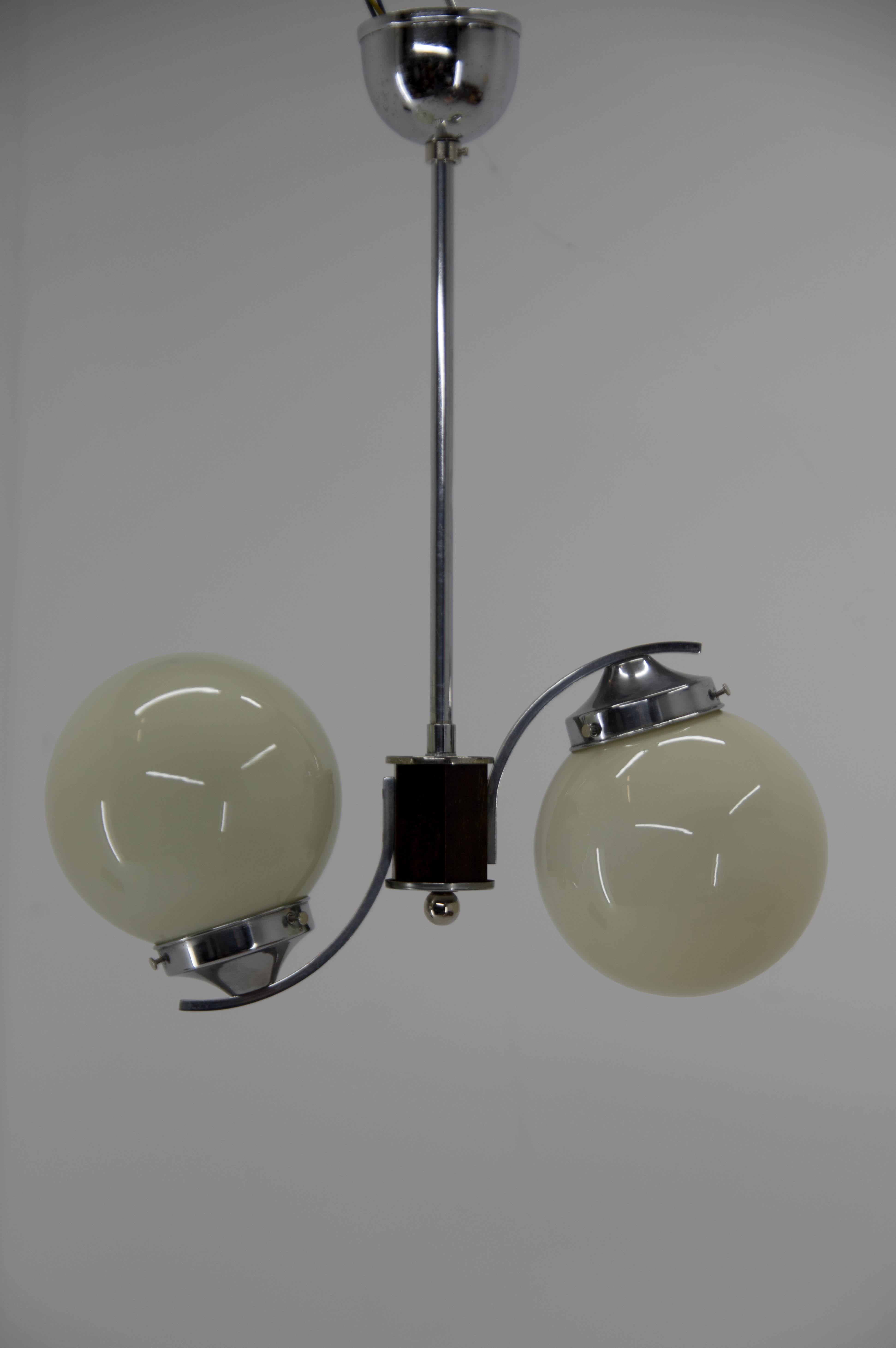 Two-flamming Art Deco chandelier attributed to Jindrich Halabala.
Chrome with minor age patina - polished
Glass in perfect condition.
Rewired - 2 x 60 W, E25-E27 bulbs
US wiring compatible.