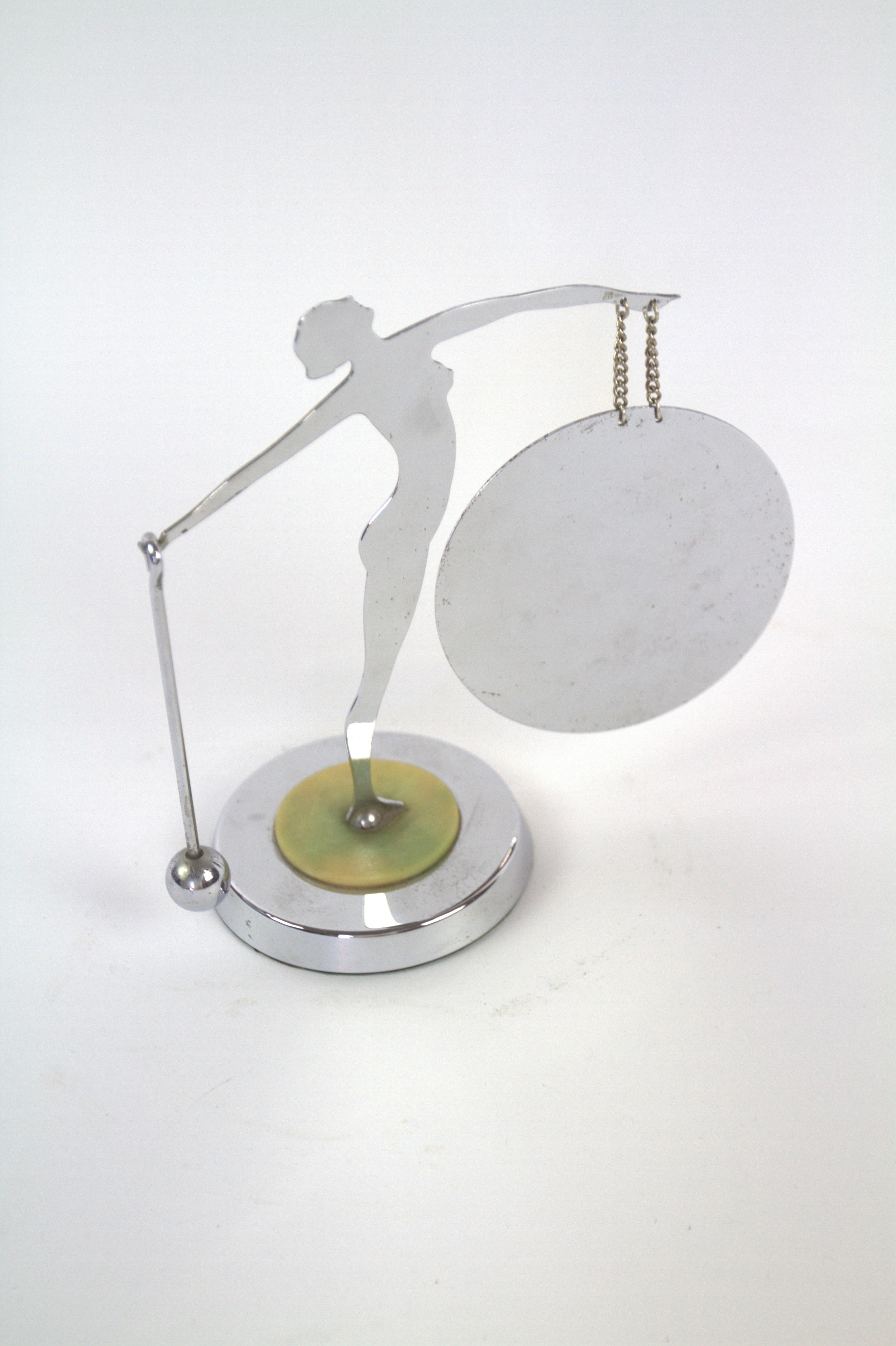 Art Deco Chrome Silhouette Lady Table Gong  with beater 
1930s
Standing on Circular Green Bakelite Disc on top of Chrome base
Chrome in good original Condition
