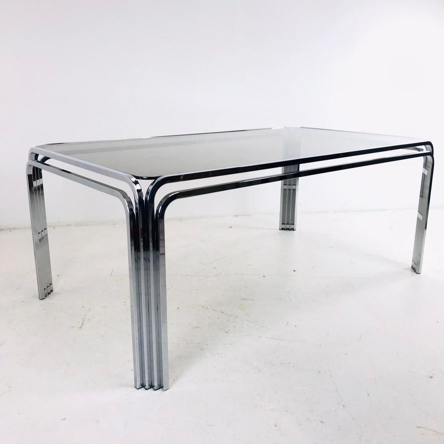 Beautiful vintage chrome art deco dining table. Includes smoke glass top. Good structural condition with some scuffs/marks - see photos for details.
