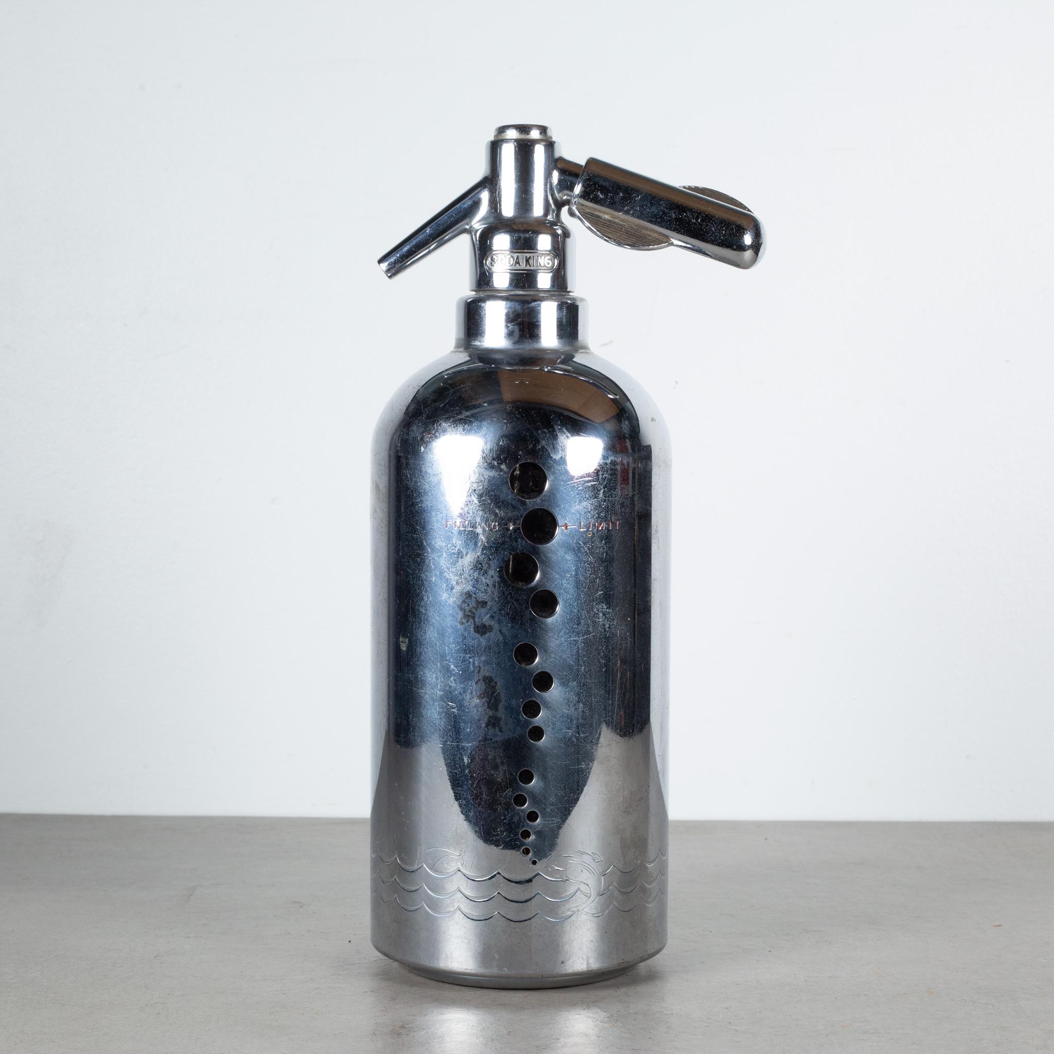 ABOUT

An original Art Deco Soda King seltzer syphon. The thick glass bottle has a chrome sleeve with bubble cut outs and whales, dolphins and waves etched on the bottom. The bottle has the complete mechanisms including the charger holder. This