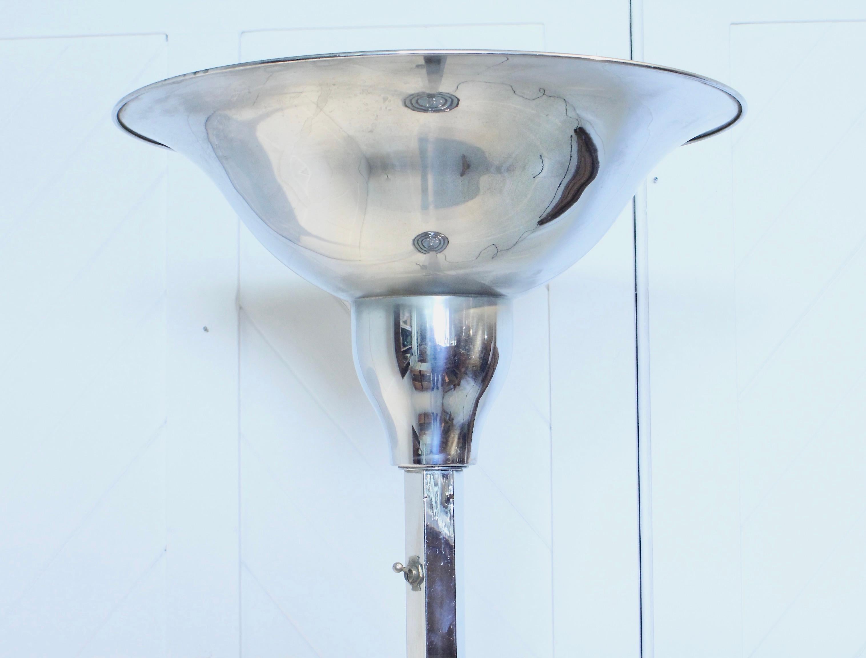 A fabulous original Art Deco chrome standard lamp
The base is in chrome with black stepped detailing
The chrome uplighter has a holophane internal glass shade
Circa 1930.