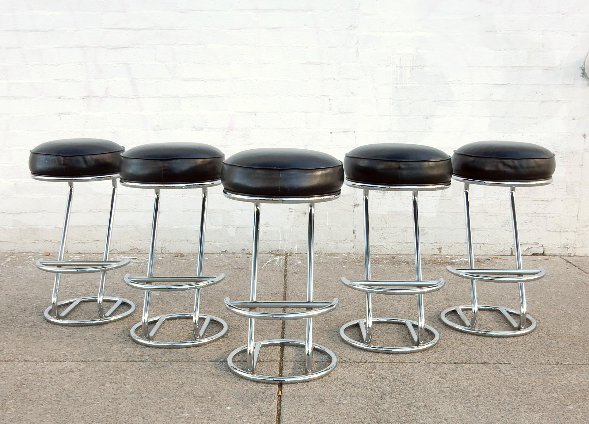 Set of 5 tall bar stools from the 1960s.
Sculpted of steel tubing with triple chrome plating.
Muffin top seating area consisting of premium black leather
filled with the finest plush memory foam.
Heavy solid and very comfortable.
32 inch to top