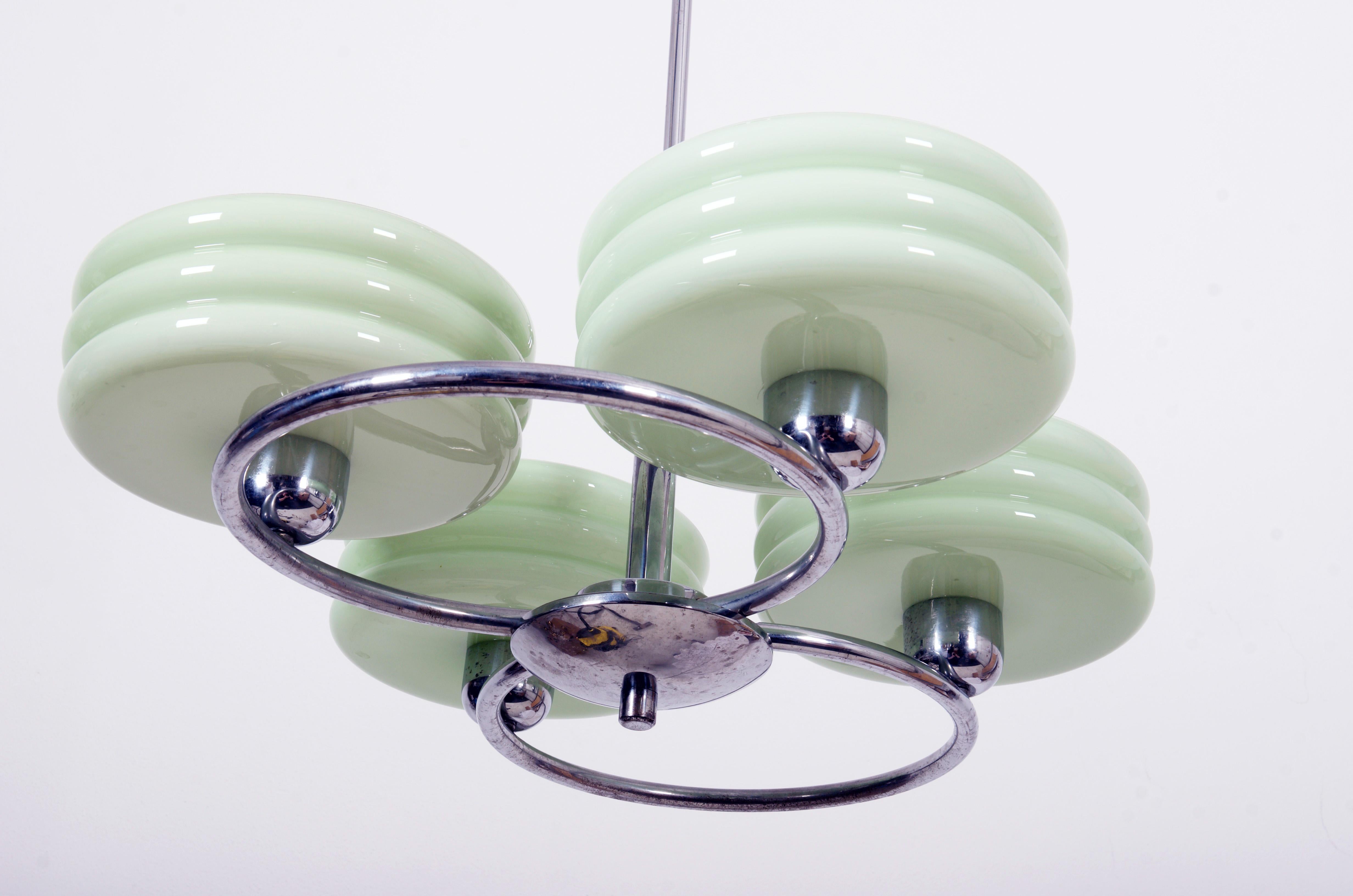 Bras frame chrome-plated, green glass lampshades (pink, beige on request possible)
The body consists of two large chrome circles with a diameter of 285mm each.
Lampshades are shaped like a bowl, interior glass is pure white and light green