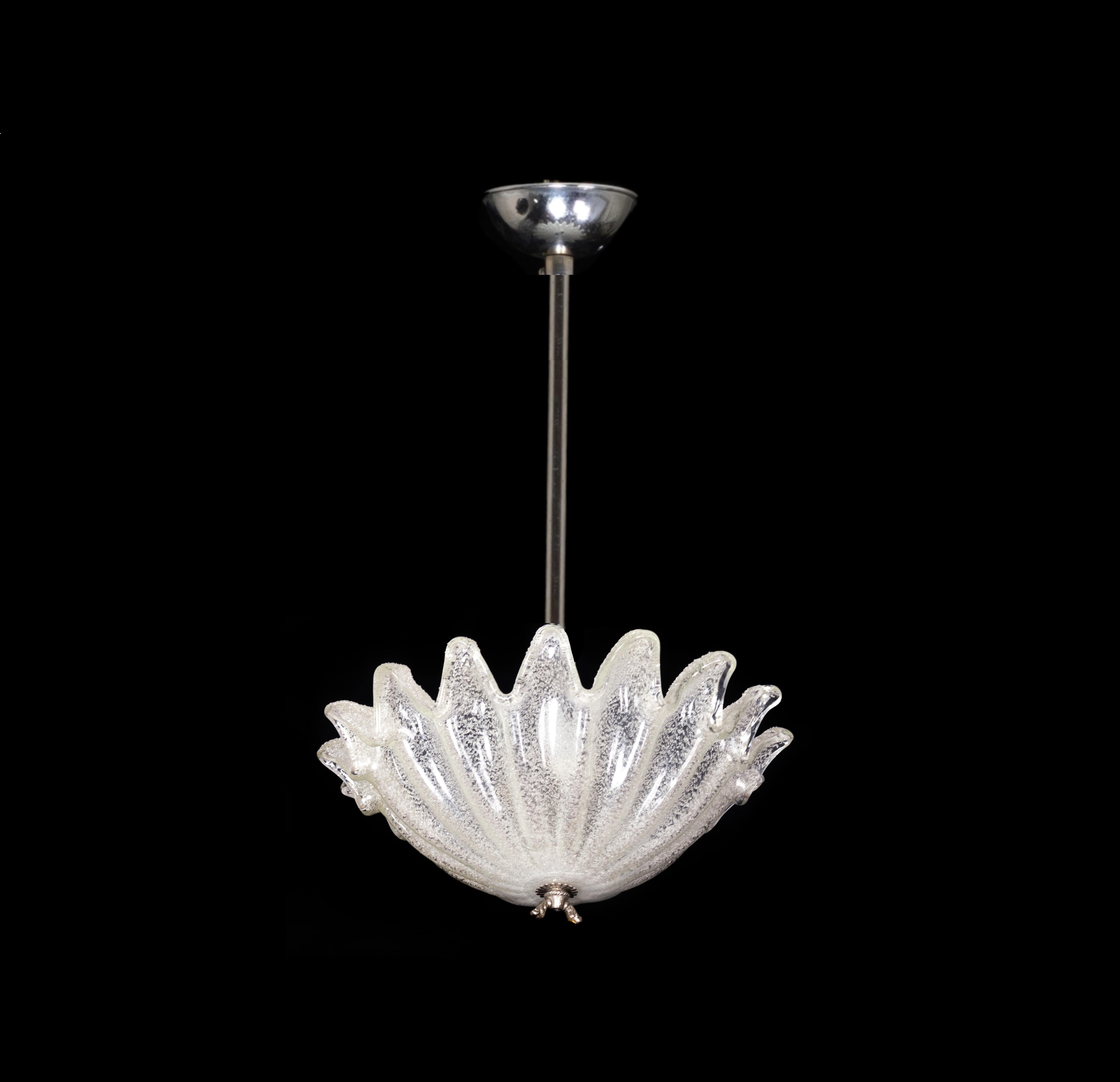 A chandelier with a  translucent Murano style glass with canopy,  stylized leaf dome with a a central light and a chromed stem.
Reviewed recently and in working conditions.  
Dimensions: Height 55 cm diameter 40 cm

The chandelier is currently wired