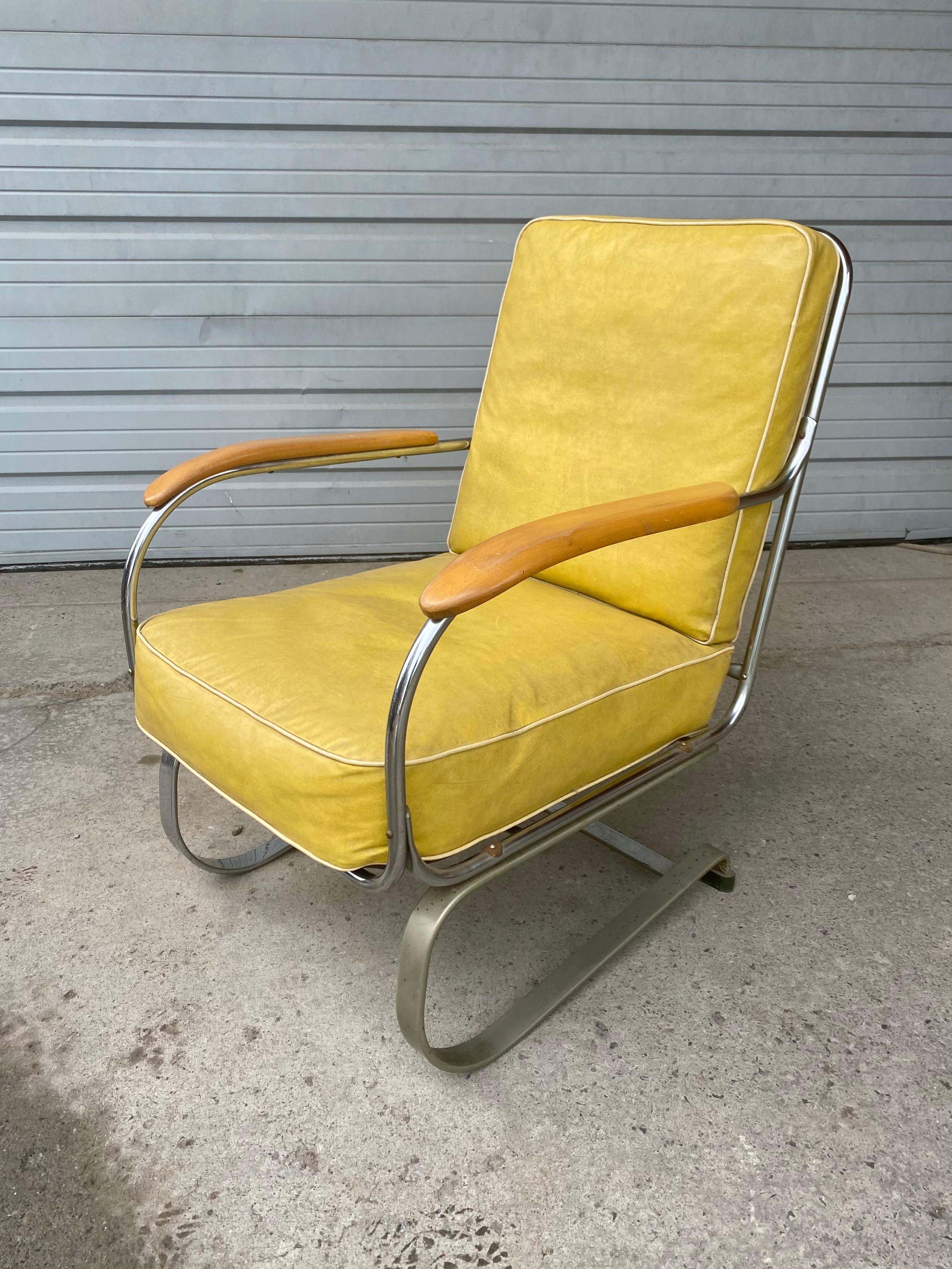 Unmolested Art Deco springer lounge chair designed by Kem Weber manufactured by Lloyd, amazing original condition. Extremely comfortable. Retains original pal yellow naugahyde seat and back cushion. Birch wood arms .Also retains original Lloyd