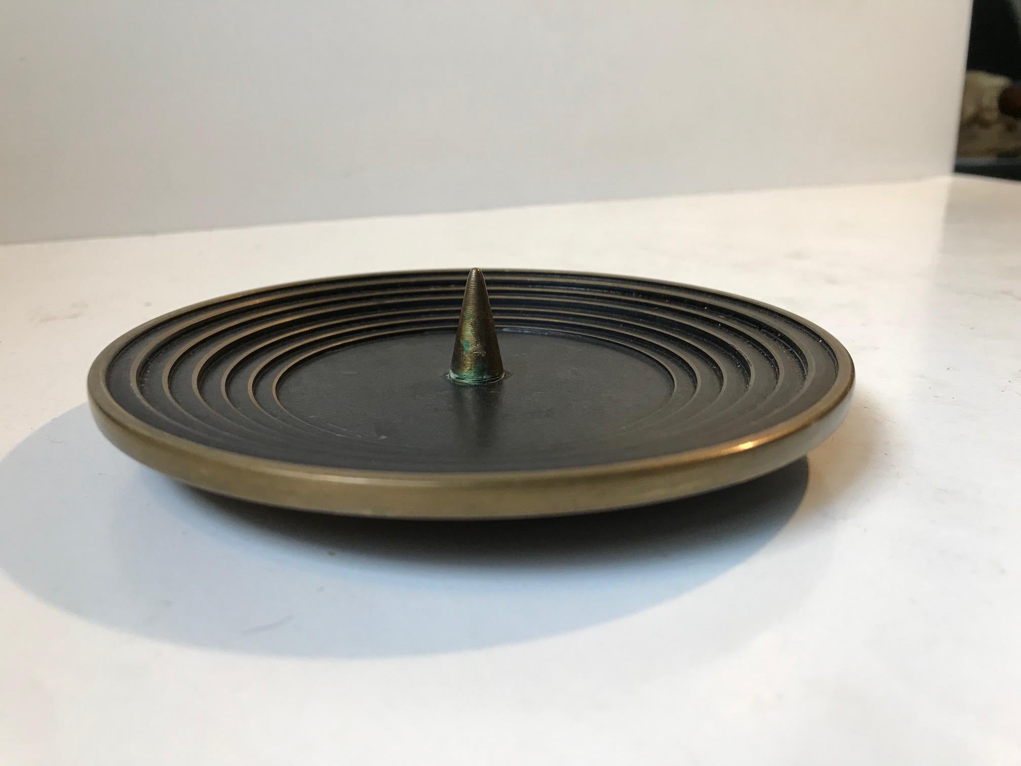 Shallow and stylish Art Deco candleholder for Church or bloc candles. Architectural feature with its 'staired' design. Manufactured in Denmark during the 1930s in a style reminiscent of Just Andersen.