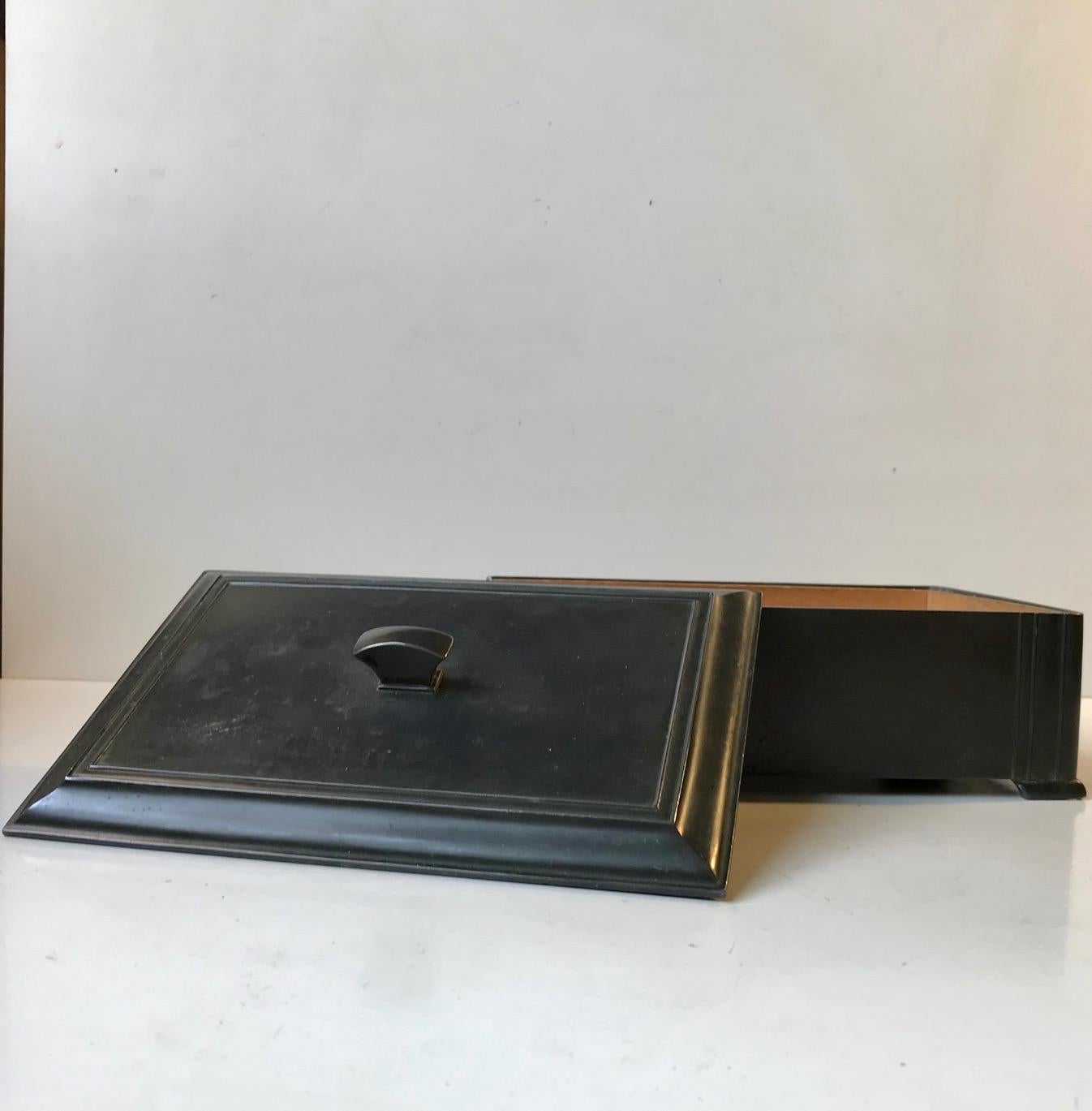 Art Deco cigar box with architectural details. Designed by Just Andersen for his own company Just and manufactured in Denmark during the 1930s. Its Made from Just's own invention Disko Metal: an alloy of bronze, pewter and a few secret ingrediens.