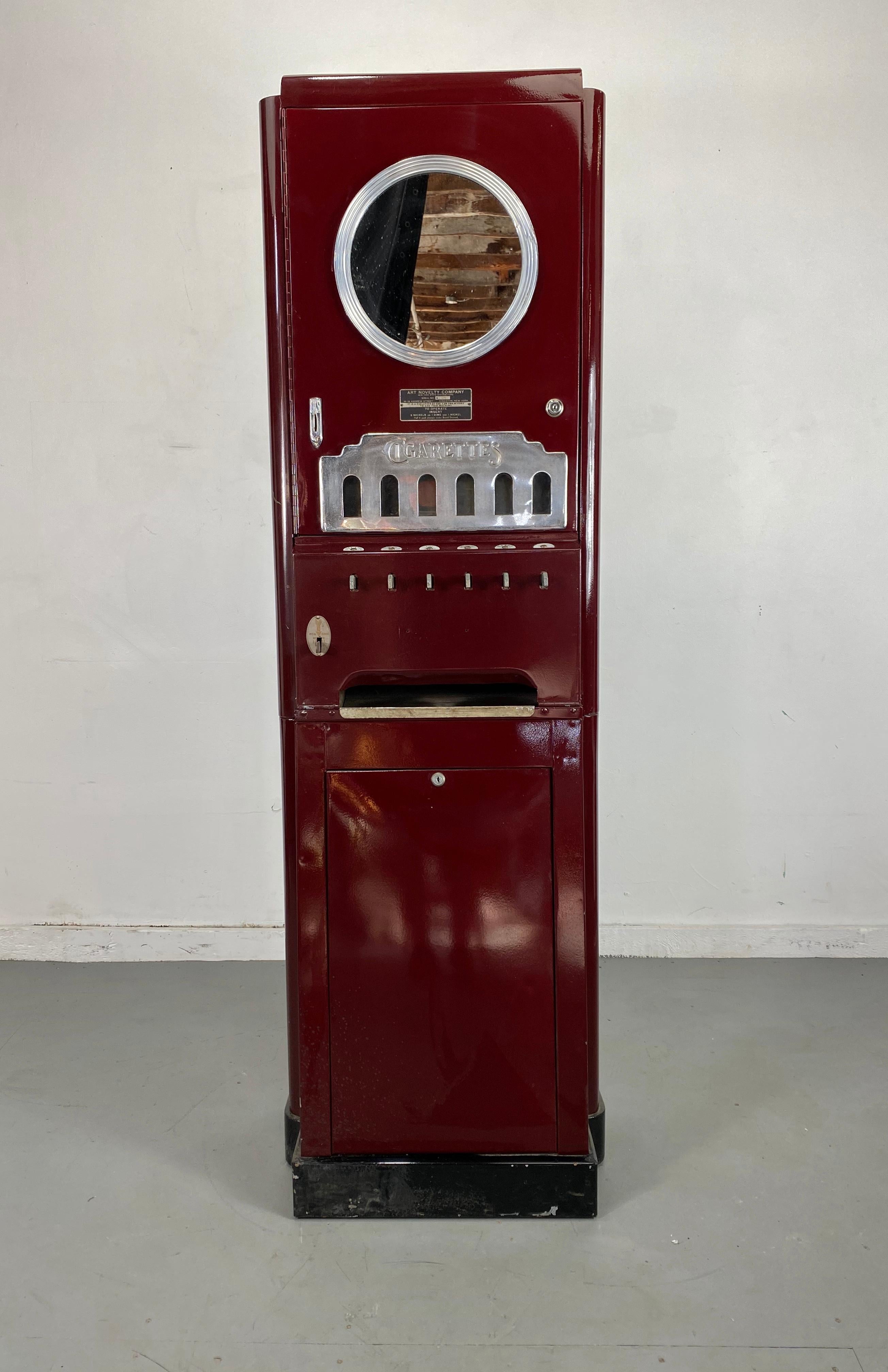 Extremely Rare Art Deco Cigarette Vending Machine ,Classic Deco Design ,made by ,Art Novelty Company,, Classic design and styling,, port-hole mirror,, 15 cent,,Hand delivery avail to New York City or anywhere en route Buffalo ny