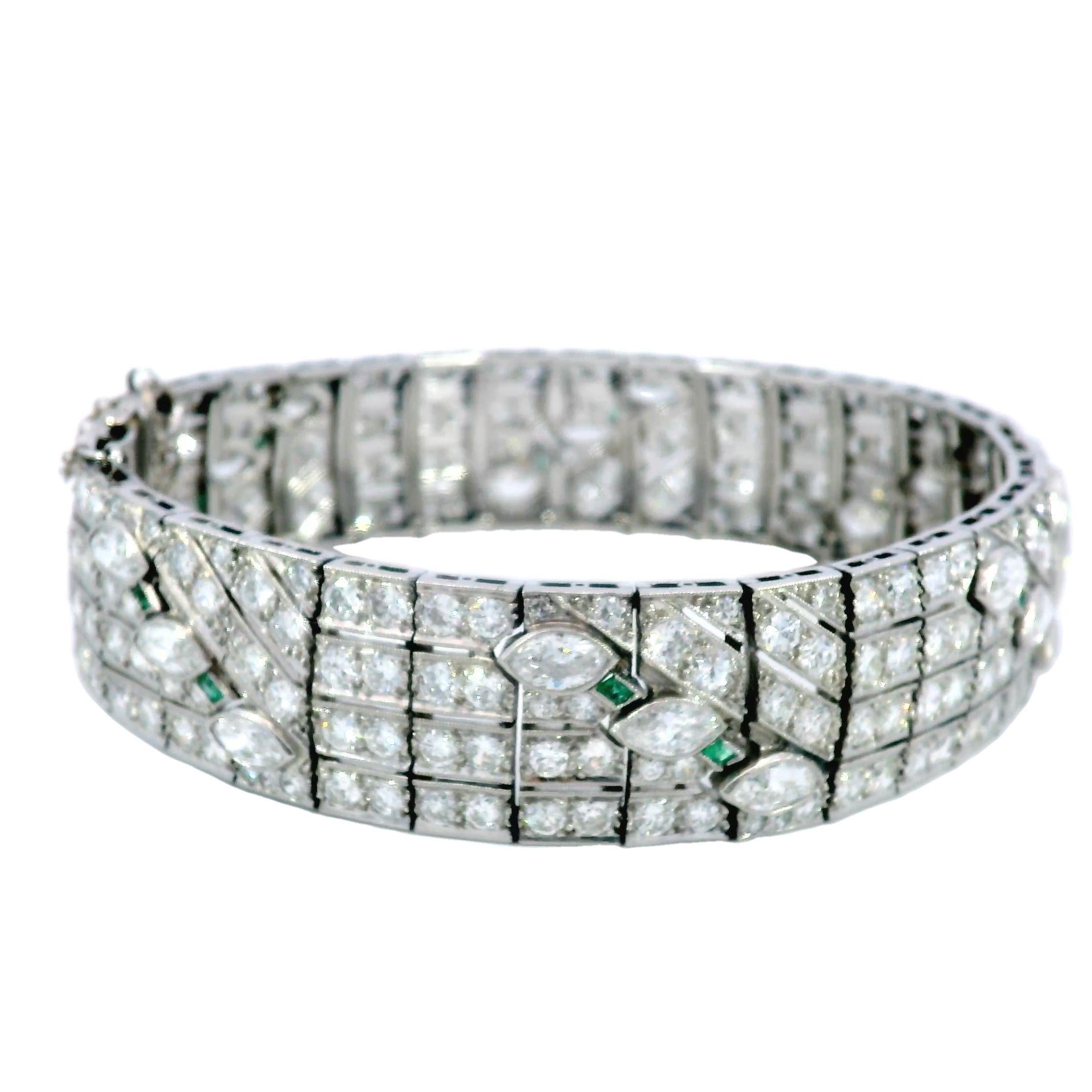 Art Deco Diamond Straight Line Bracelet Platinum With Emerald Accents ~16.87ctw

This stunning Art Deco circa 1920 Diamond and Emerald Platinum Straight Line Bracelet showcases approximately 16.87 carats of diamonds, including a striking .95 carat