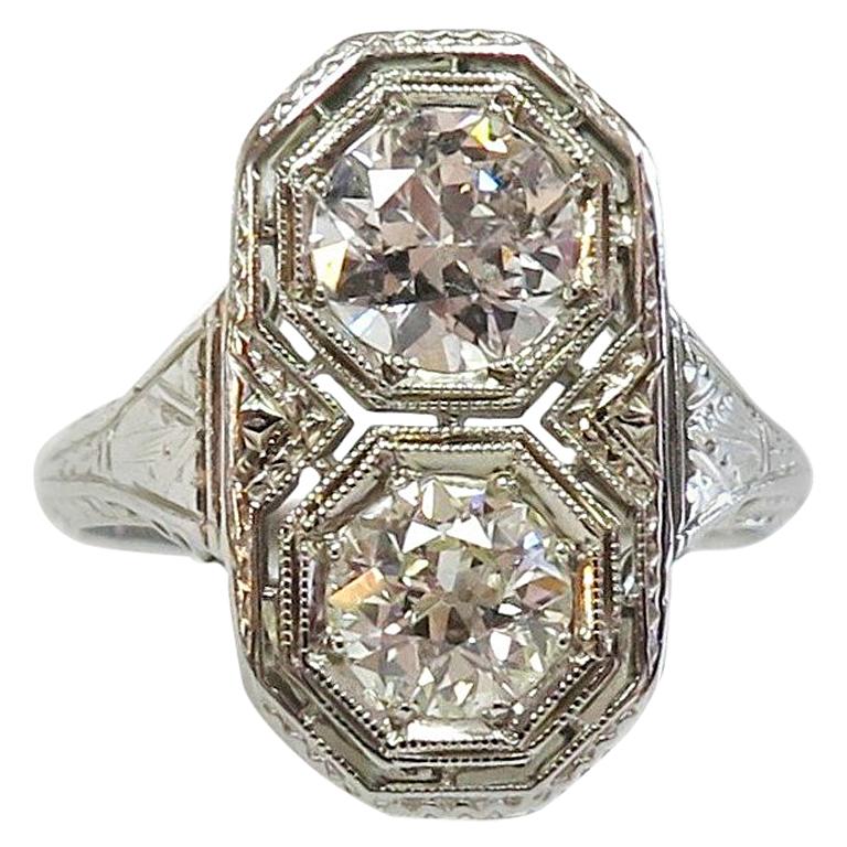 Art Deco circa 1930, Two-Stone Filigree Ring in 18 Karat White Gold For Sale