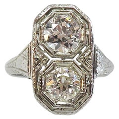 Art Deco circa 1930, Two-Stone Filigree Ring in 18 Karat White Gold