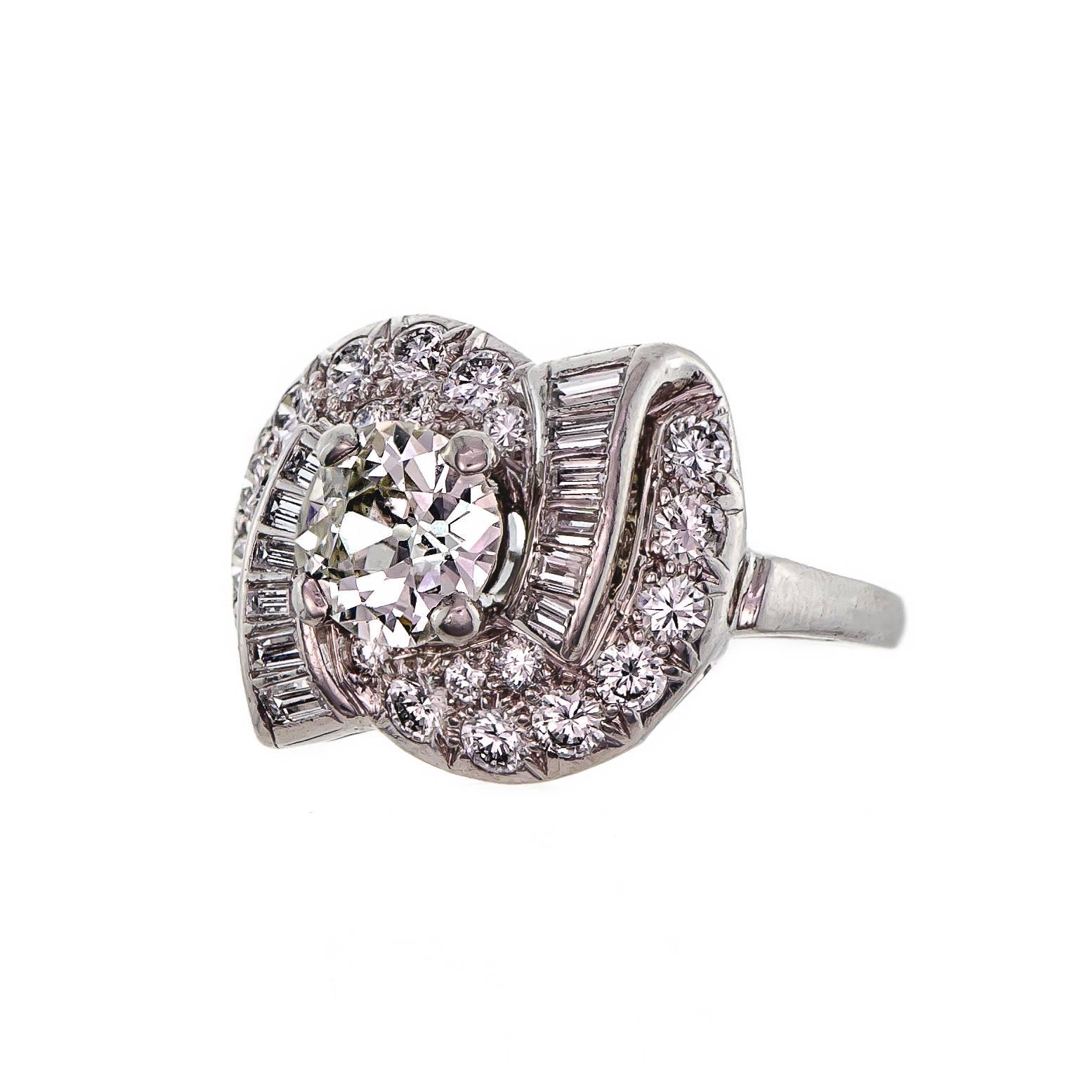 Beautiful vintage circa 1930s platinum and diamond cocktail ring set with one Old European Cut diamond measuring appxoimately 6.7 -6.85 X 3.47 mm approx weight 1.01 cts  SI1-2 clarity, J-K color four prong set into a platinum ring mount inside shank