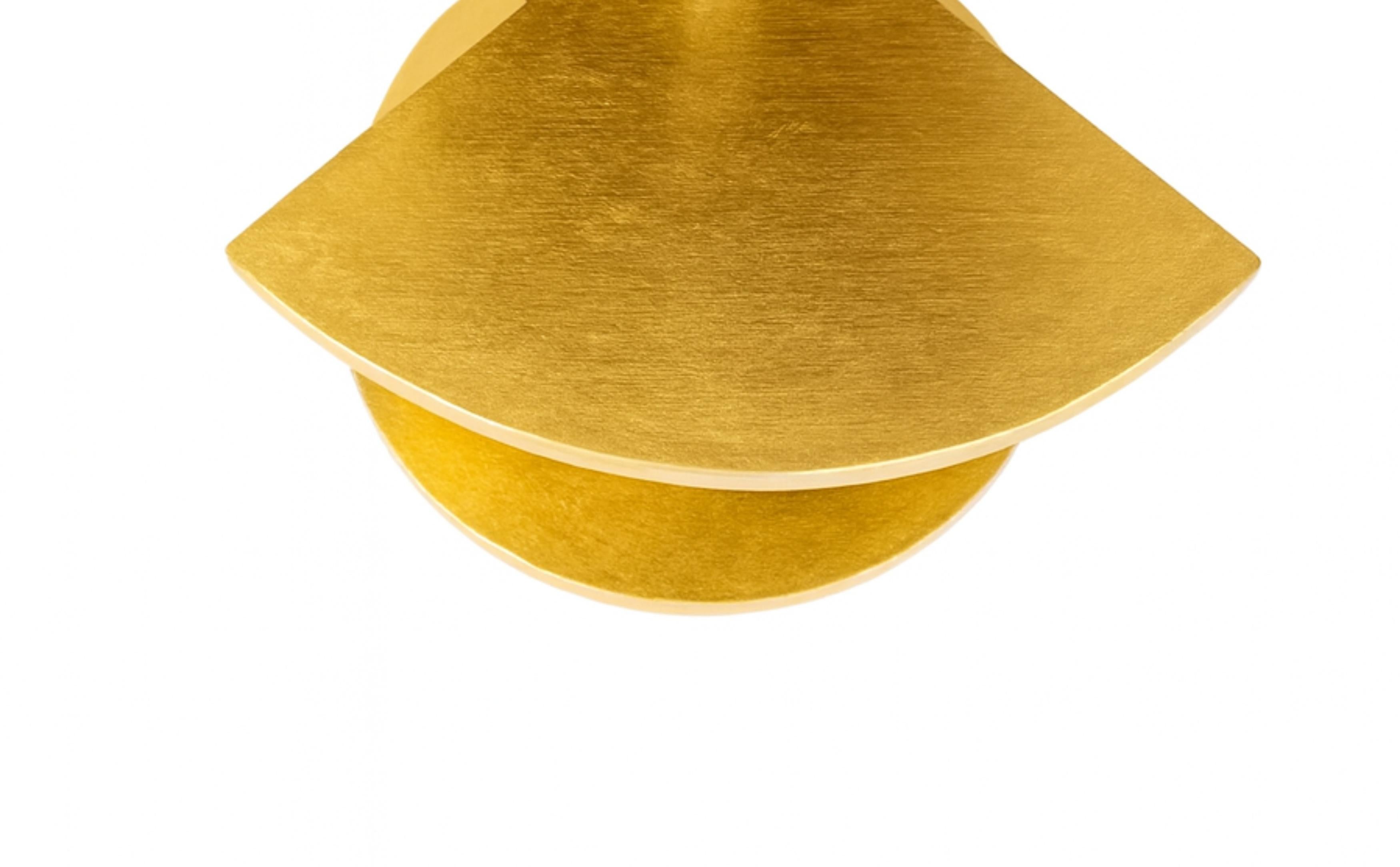 This Art Deco gilt C-Shaped Two Tier Side Table design with a triangle finish, expertly crafted in chestnut and a metal column.

It has an elegant and rare design, with two smooth circular trays, one placed atop the other, supported by a C-shaped